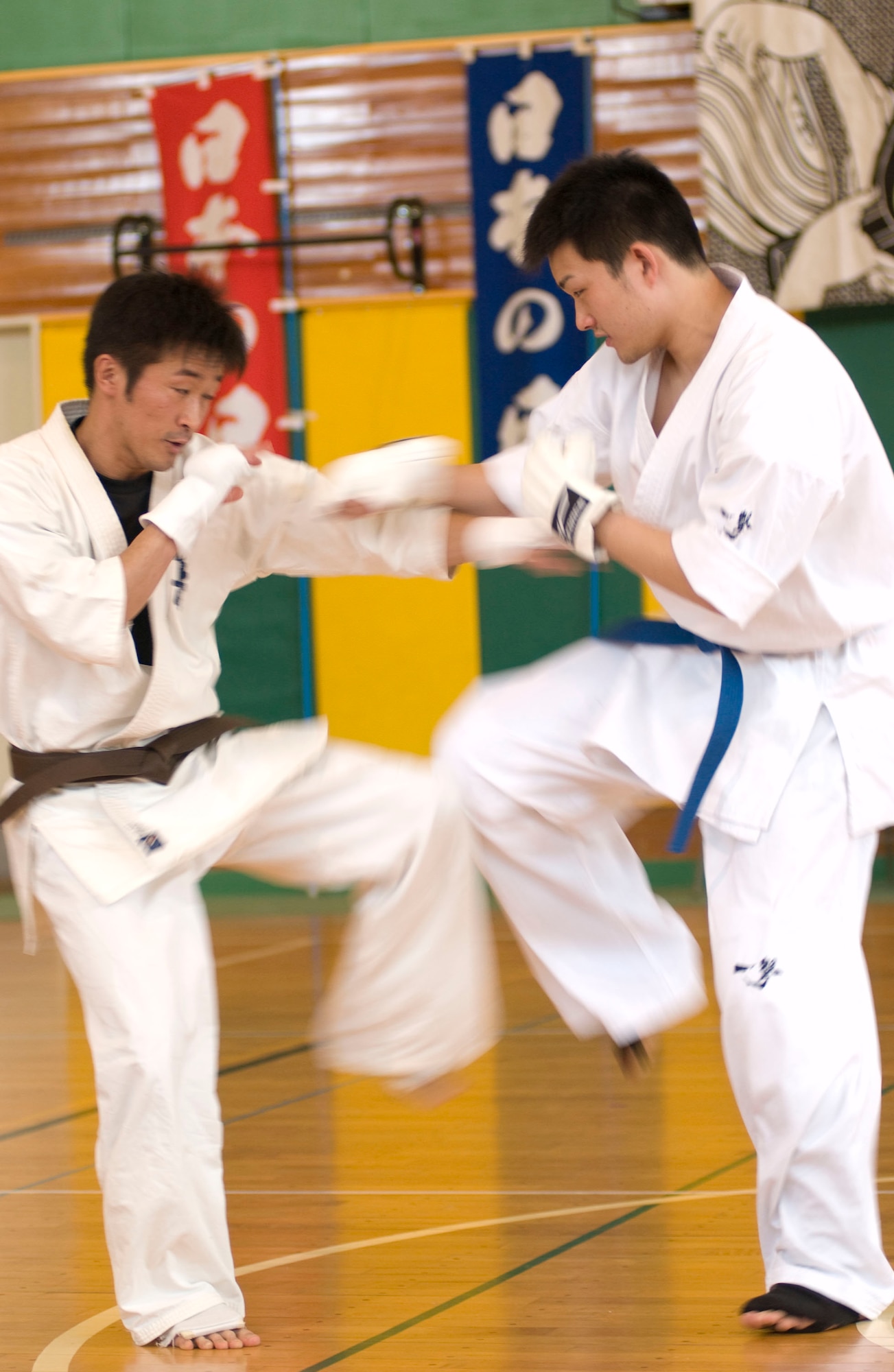 MISAWA AIR BASE, Japan – Two practitioners of karate participate in a sparring match in the Edgren High School Gymnasium on April 5, 2008. The karate school showcased several aspects of their martial during “Japan Day” at Misawa Air Base. (U.S. Air Force photo by Senior Airman Samuel Morse)