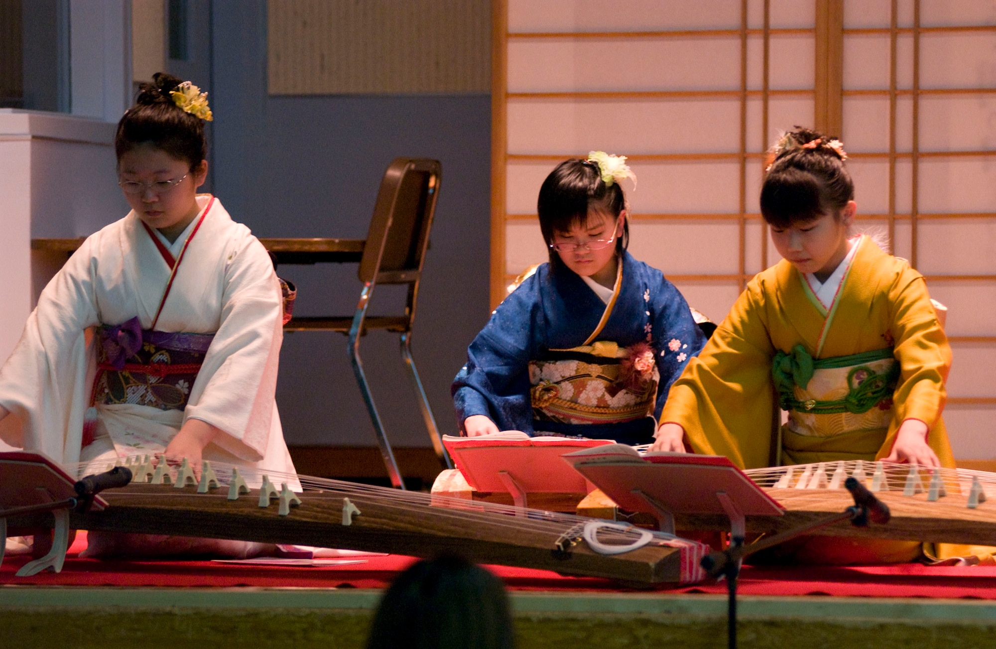 MISAWA AIR BASE, Japan – Members of Sokyoku Seigensha play koto music at Edgen High School on April 5, 2008. The performance helped to expose Americans to Japanese culture during “Japan Day” at Misawa Air Base. (U.S. Air Force photo by Senior Airman Samuel Morse)