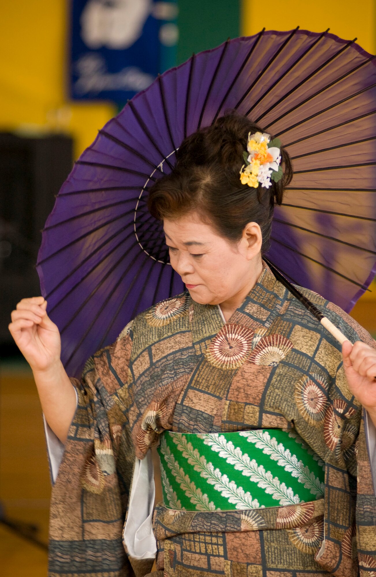 MISAWA AIR BASE, Japan – A Japanese woman demonstrates traditional Japanese dancing in the Edgren High School gymnasium on April 5, 2008. The demonstration helped to foster multicultural exchange during Misawa Air Base’s “Japan Day”. (U.S. Air Force photo by Senior Airman Samuel Morse)