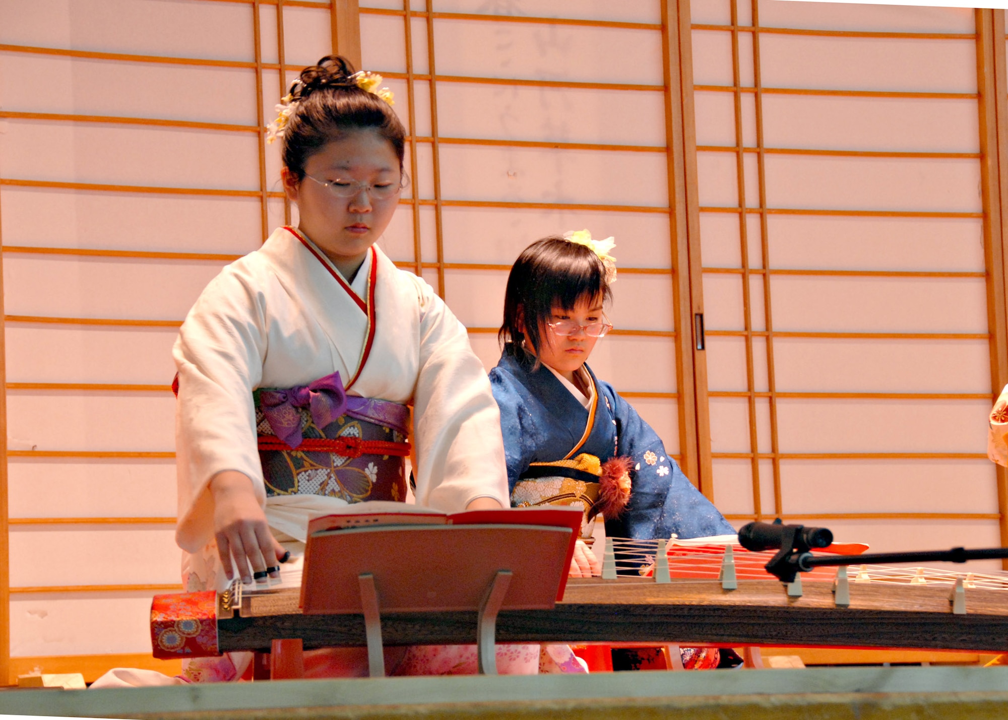 MISAWA AIR BASE, Japan – Members of Sokyoku Seigensha play koto music for an American audience during Japan Day here April 5, 2008. The koto is the national instrument of Japan. (U.S. Air Force photo by Staff Sgt. Rachel Martinez)