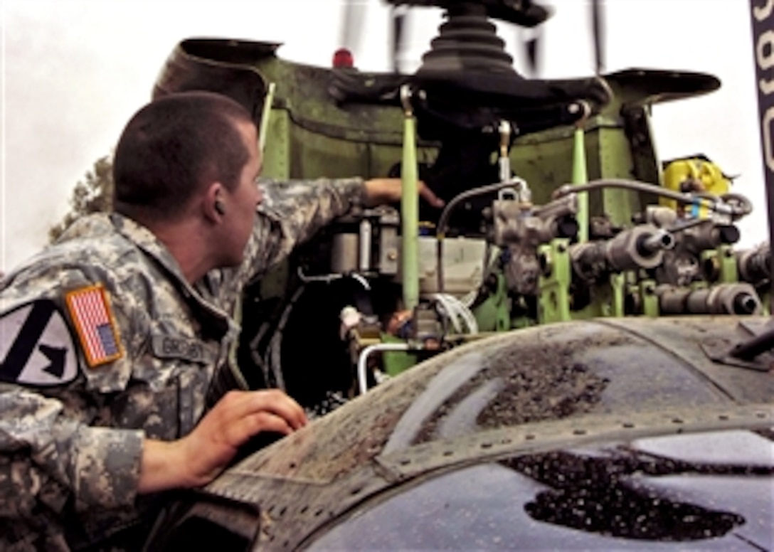 U.S. Army Sgt. William Grigsby adjusts torque tolerances on the mast of an OH-58D Kiowa helicopter on Logistical Support Area Diamondback, Mosul, Iraq, April 7, 2008. Grigsby is assigned to E Troop, 4th Squadron, 6th Air Cavalry Regiment.