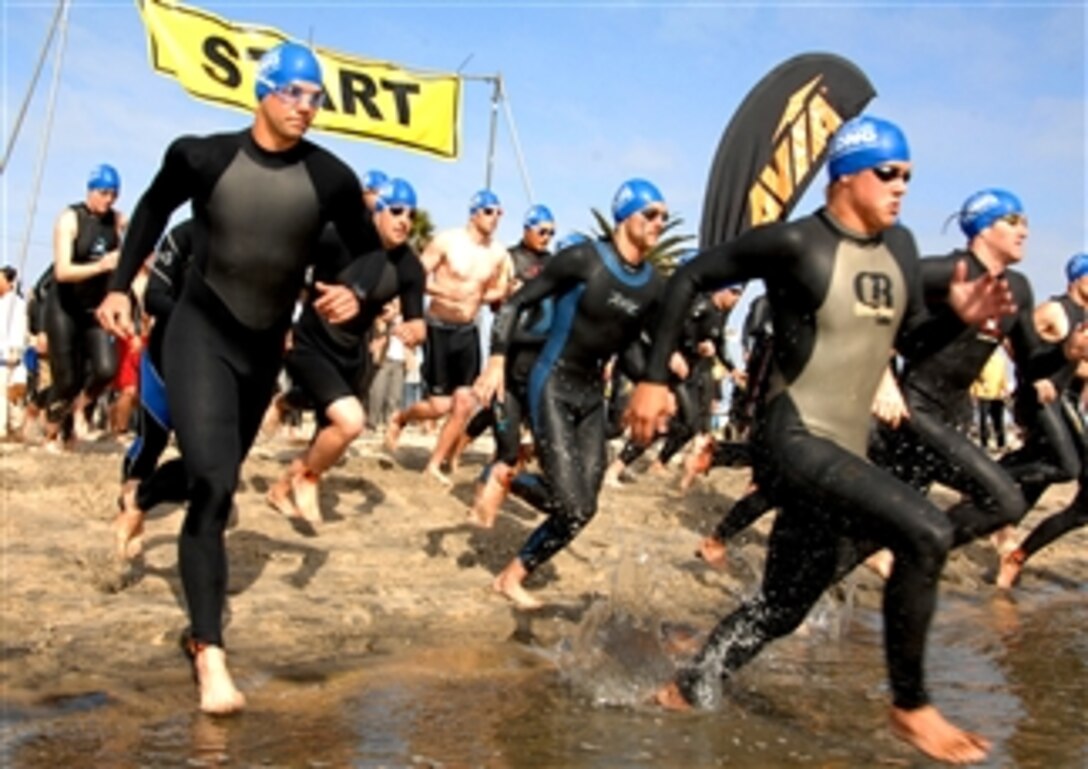 Athletes race to begin the swim portion of the first SUPERSEAL triathlon at Silver Strand State Beach, Calif., April 6, 2008. Proceeds from the event help fund the Naval Special Warfare Foundation, a non-profit group that supports servicemembers and their families.