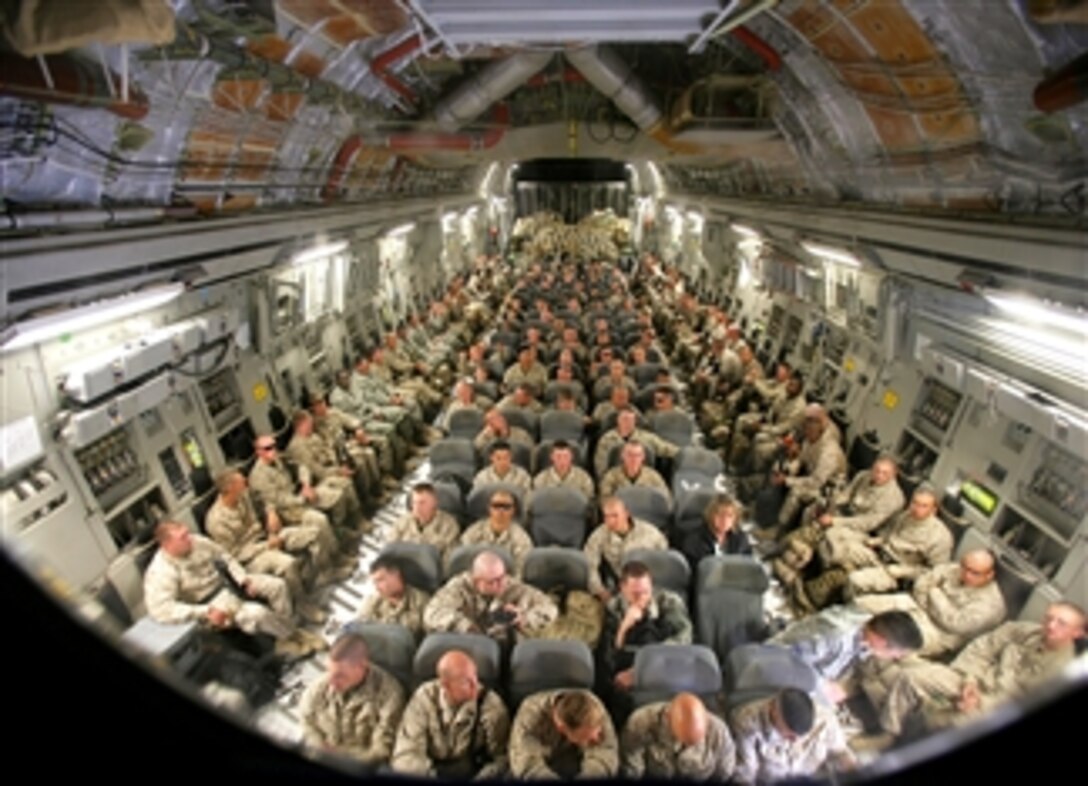 U.S. Marines assigned to the 2nd Battalion, 7th Marine Regiment, wait aboard a C-17 Globemaster III aircraft at Manas Air Base, Kyrgyz Republic, March 27, 2008, to be flown to Kandahar Air Base in the Helman province of Afghanistan.