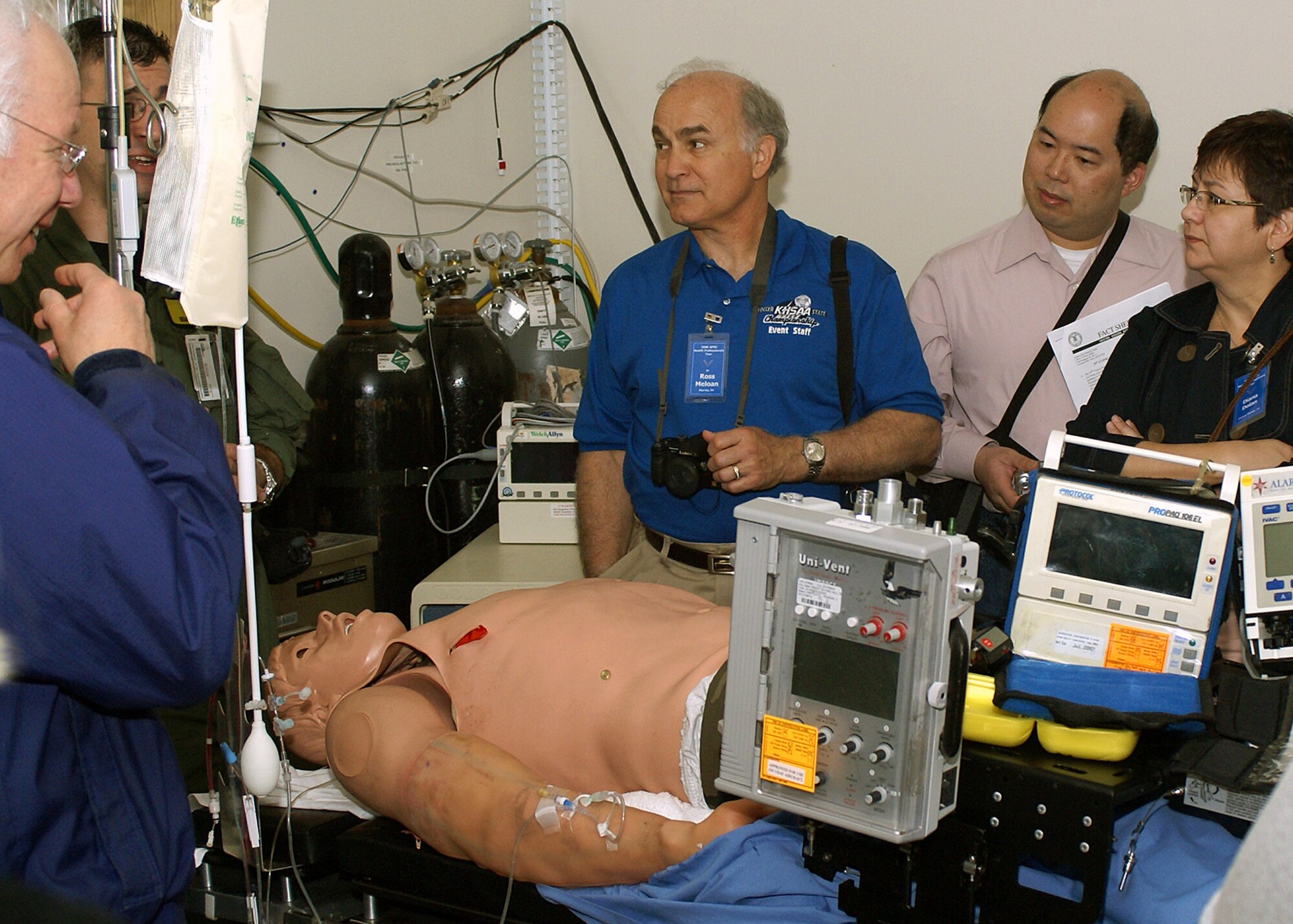 Capt. Shaun Westphal, second from left, 59th Medical Wing Critical Care Air Transportation Team nurse, shows tour guests how CCATT Airmen use simulators to practice their medical care and evacuation skills at Wilford Hall Medical Center at Lackland Air Force Base, Texas, April 11. Air Force Recruiting Service conducts two four-day Health Professions tours in San Antonio, Texas, annually to show educators that the Air Force is a viable career opportunity for their best students. People interested in participating in the tours should contact their nearest Air Force Health Professions recruiter. (U.S. Air Force photo/Chet Delsignore)
