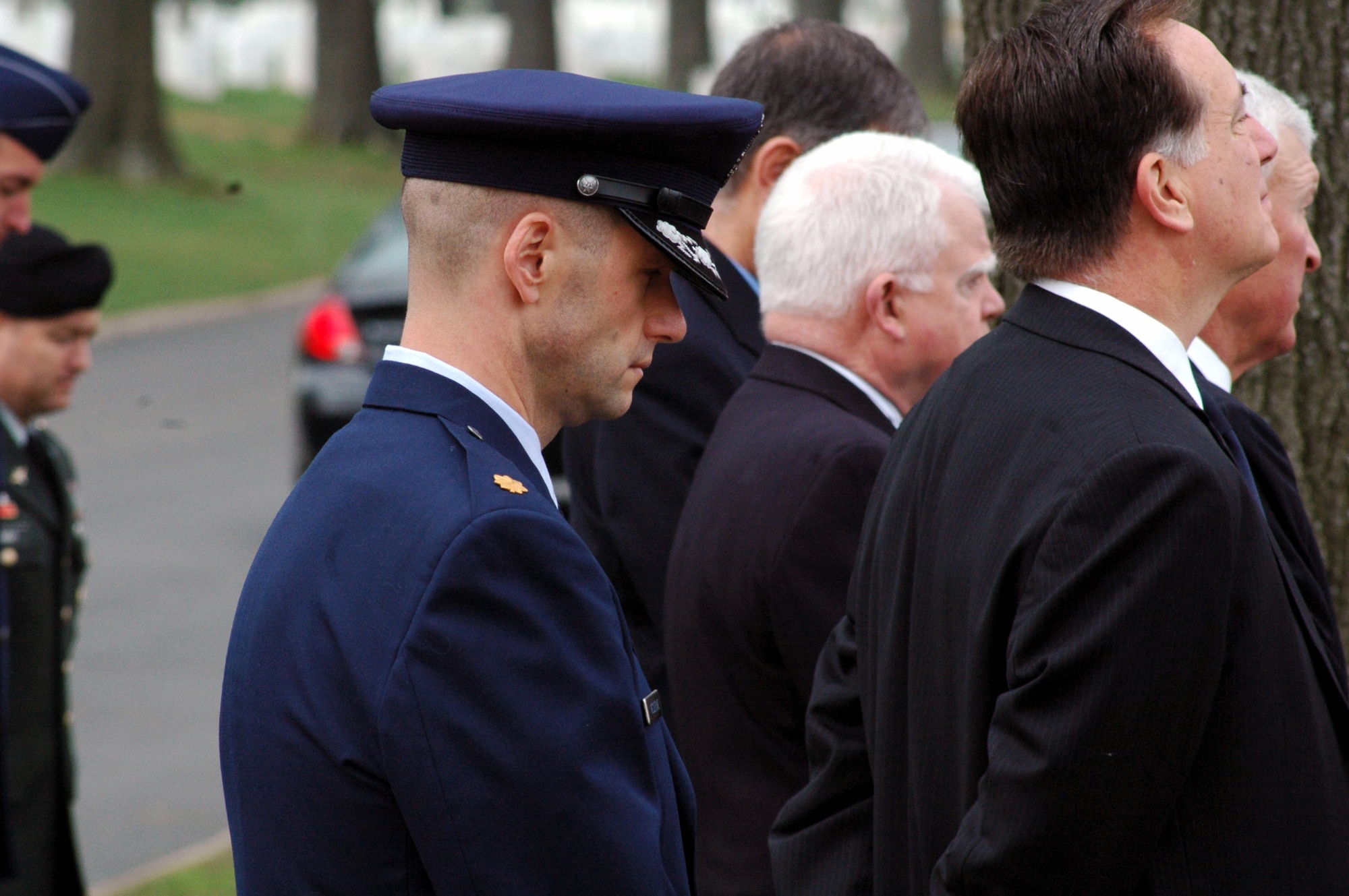 Maj. Phil Heseltine, U.S. Air Force Expeditionary Center executive officer to the commander, Fort Dix, N.J., participates in the funeral for Air Force Maj. Robert F. Woods April 9, 2008, at Arlington National Cemetery, Va.  Earlier that day, Major Heseltine presented a POW/MIA bracelet to the family of Major Woods, whose name is on the bracelet, that he wore for 18 years.  (U.S. Air Force Photo/Tech. Sgt. Scott T. Sturkol)