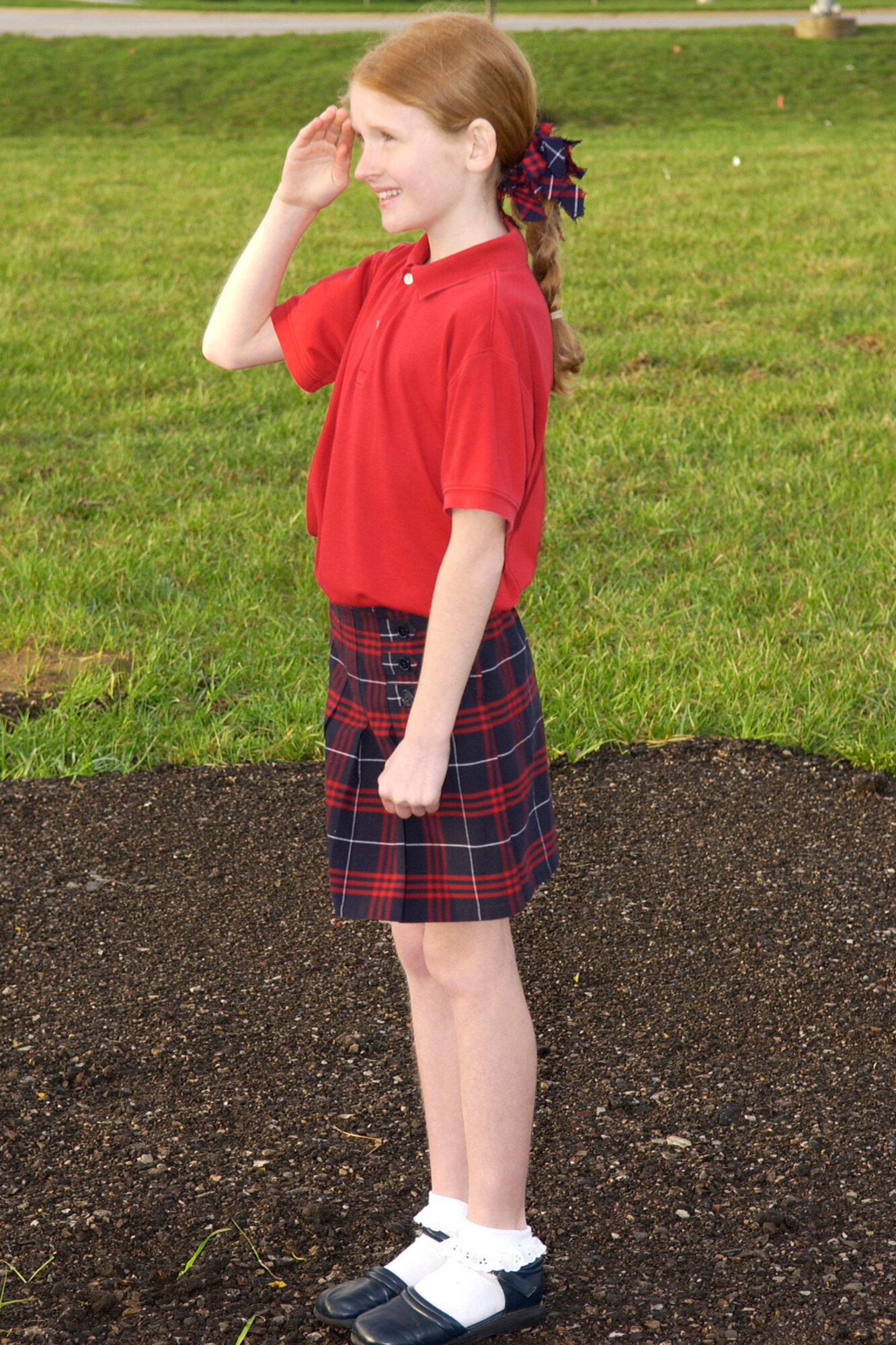 GRISSOM AIR RESERVE BASE, Ind., -- Patriotism comes in all ages as a youngster at Grissom salutes the flag.  Each day there is a formal flag raising and lowering ceremony at Grissom and it is open to all military members, civilian employees and depdendents.  (U.S. Air Force photo/Tech. Sgt. Doug Hays)                            