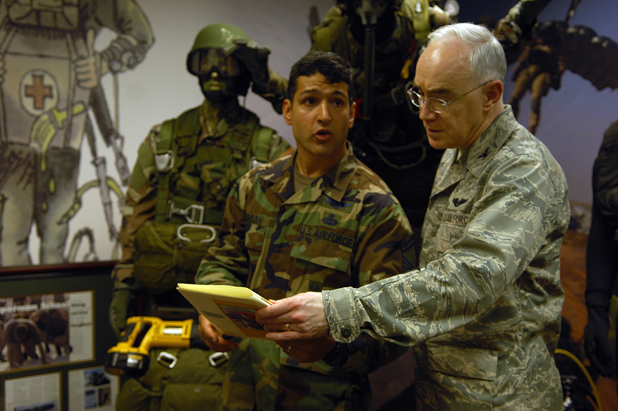 MOODY AIR FORCE BASE, Ga. -- Senior Master Sgt. Anthony Negron, 38th Rescue Squadron operations superintendant, explains future plans to finish the Jason Cunningham pararescueman memorial to ACC Chaplin Col. Bob Page here April 8. Colonel Page was at Moody to visit the operations of the base chapel and other 23rd Wing units. (U.S. Air Force photo by Senior Airman Elizabeth Rissmiller)