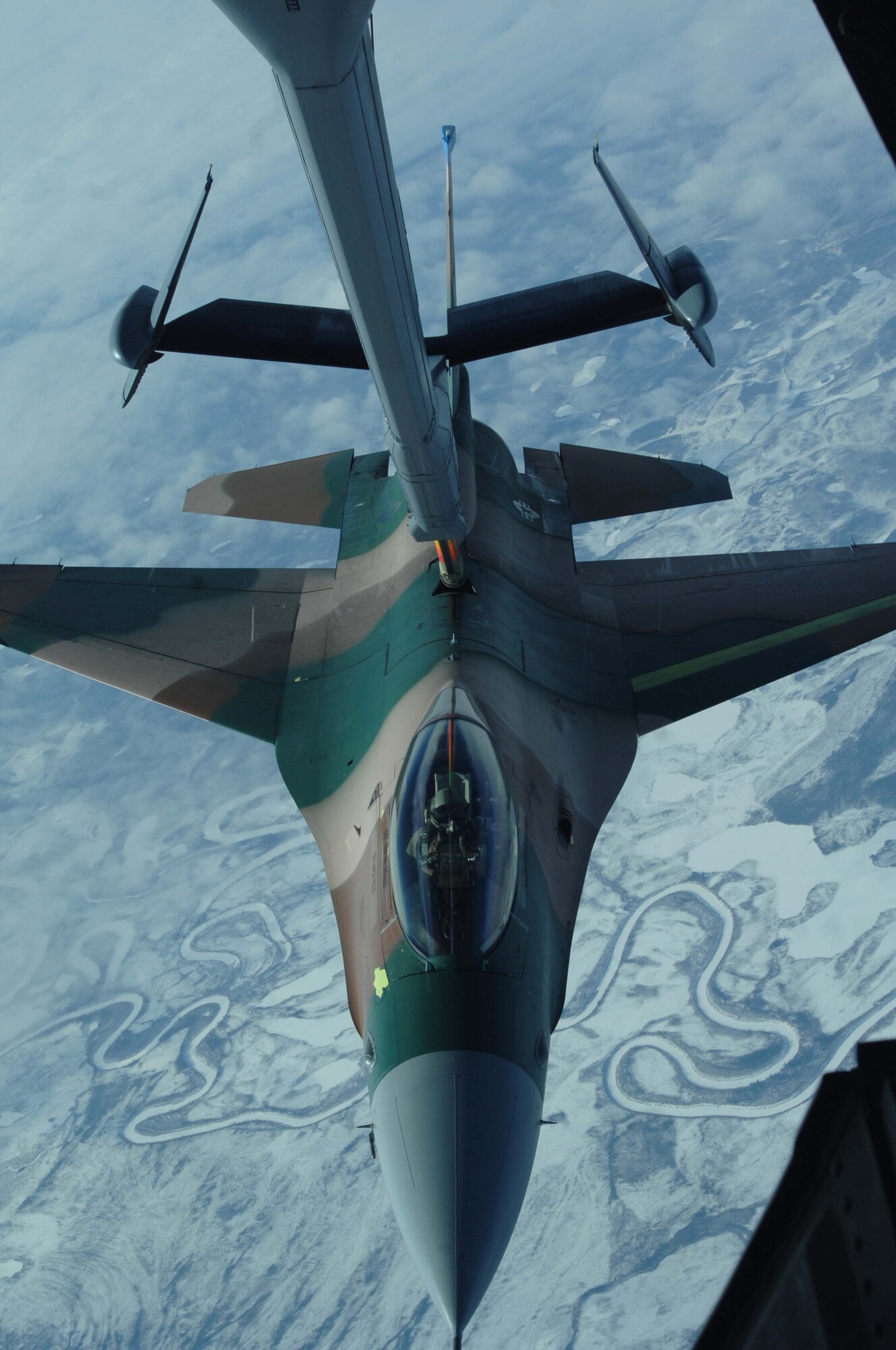 A KC-10 Extender from McGuire Air Force Base, N.J., provides inflight refueling to an F-16 Aggressor from Eielson Air Force Base, Alaska, over the Pacific Alaska Range Complex, America's largest training range, during RED FLAG-Alaska 08-2, April 9, 2008. RED FLAG-Alaska is a multinational air combat training exercise that began April 3 and will conclude July 18.  (U.S. Air Force photo/Staff Sgt. Tia Schroeder)
