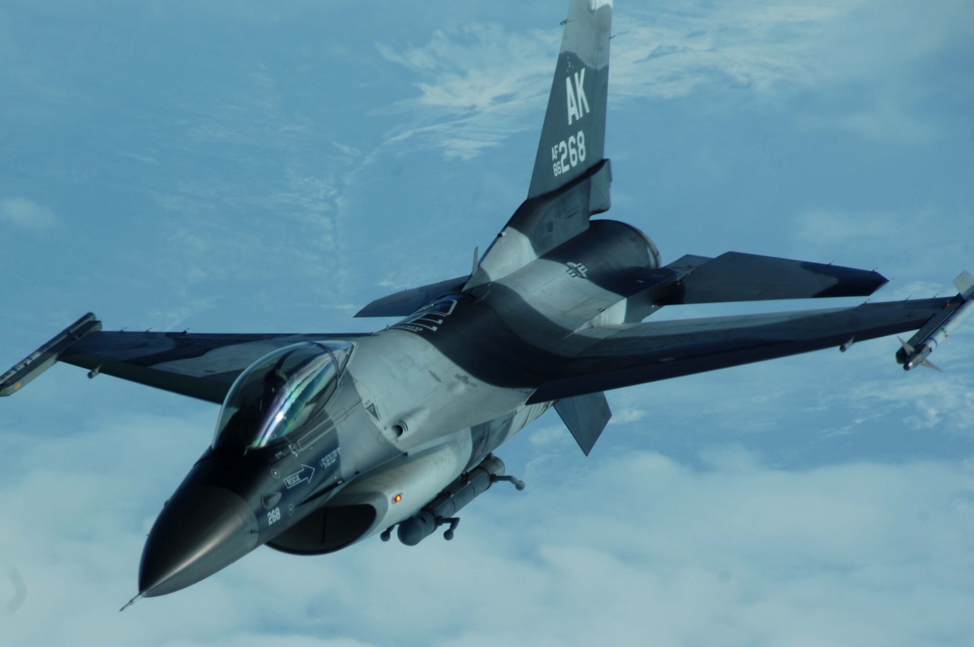 An F-16 Aggressor from Eielson Air Force Base, Alaska,  flies along side a KC-10 Extender during RED FLAG-Alaska 08-2, April 9, 2008. RED FLAG-Alaska is a series of Pacific Air Force field training exercises for U.S and allied forces that provide joint offensive counter-air, indirection, close air support, and large force employment training in a simulated combat environment.  (U.S. Air Force photo/Staff Sgt. Tia Schroeder)
