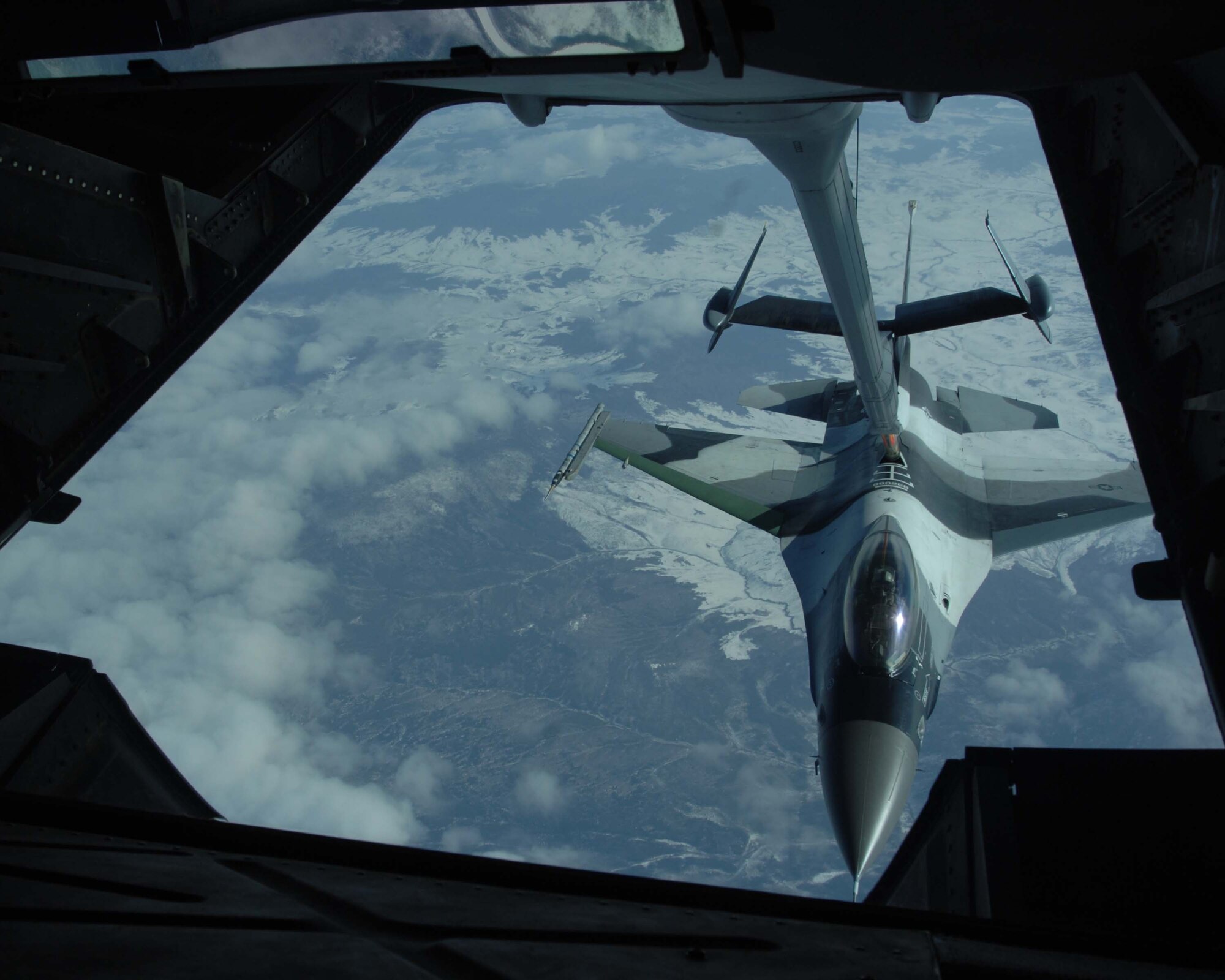 A KC-10 Extender from McGuire Air Force Base, N.J., provides inflight refueling to an F-16 Aggressor from Eielson Air Force Base, Alaska, over the Pacific Alaska Range Complex, America's largest training range, during RED FLAG-Alaska 08-2, April 9, 2008. RED FLAG-Alaska is a multinational air combat training exercise that began April 3 and will conclude April 18.  (U.S. Air Force photo/Staff Sgt. Tia Schroeder)