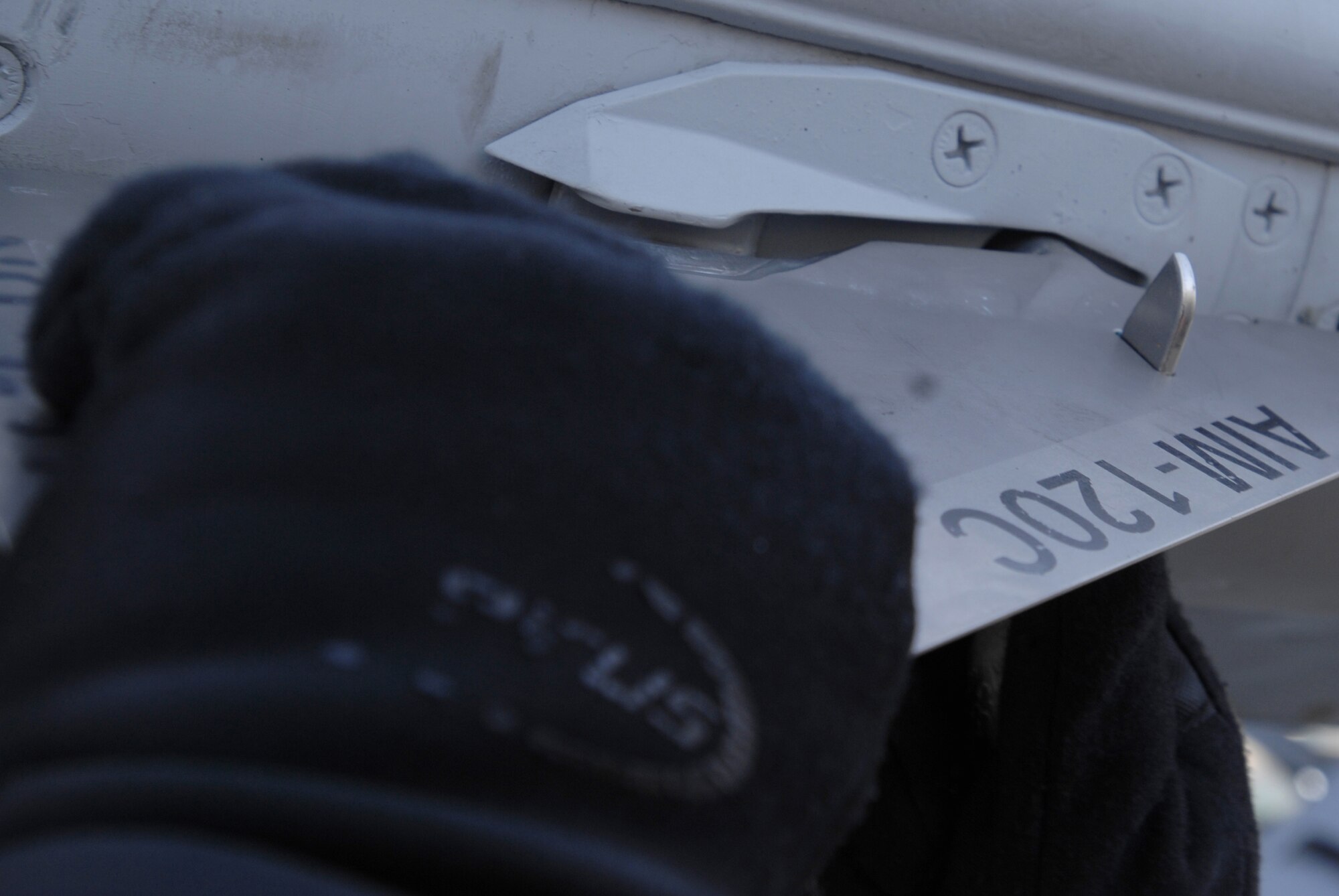 A tail fin is attached to an AIM-120 missile loaded on a F-16 Fighting Falcon April 9, 2008, during pre-flight preparations for RED FLAG-Alaska 08-2 exercise at Eielson Air Force Base, Alaska.  RED FLAG-Alaska is a series of Pacific Air Forces field training exercises for U.S. forces and allies that provides joint offensive counter-air, close air support and large forces employment training in a simulated combat environment.

(U.S Air Force Photo by Tech Sgt. Eric T. Sheler)
