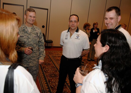 SCOTT AIR FORCE BASE, Ill. – Brig. Gen. Steven Lepper, Air Mobility Command staff judge advocate, talks with 12 Outstanding Airmen nominees during the icebreaker at Scott Club March 31. (U.S. Air Force photo/Airman 1st Class Megan Gilliland)