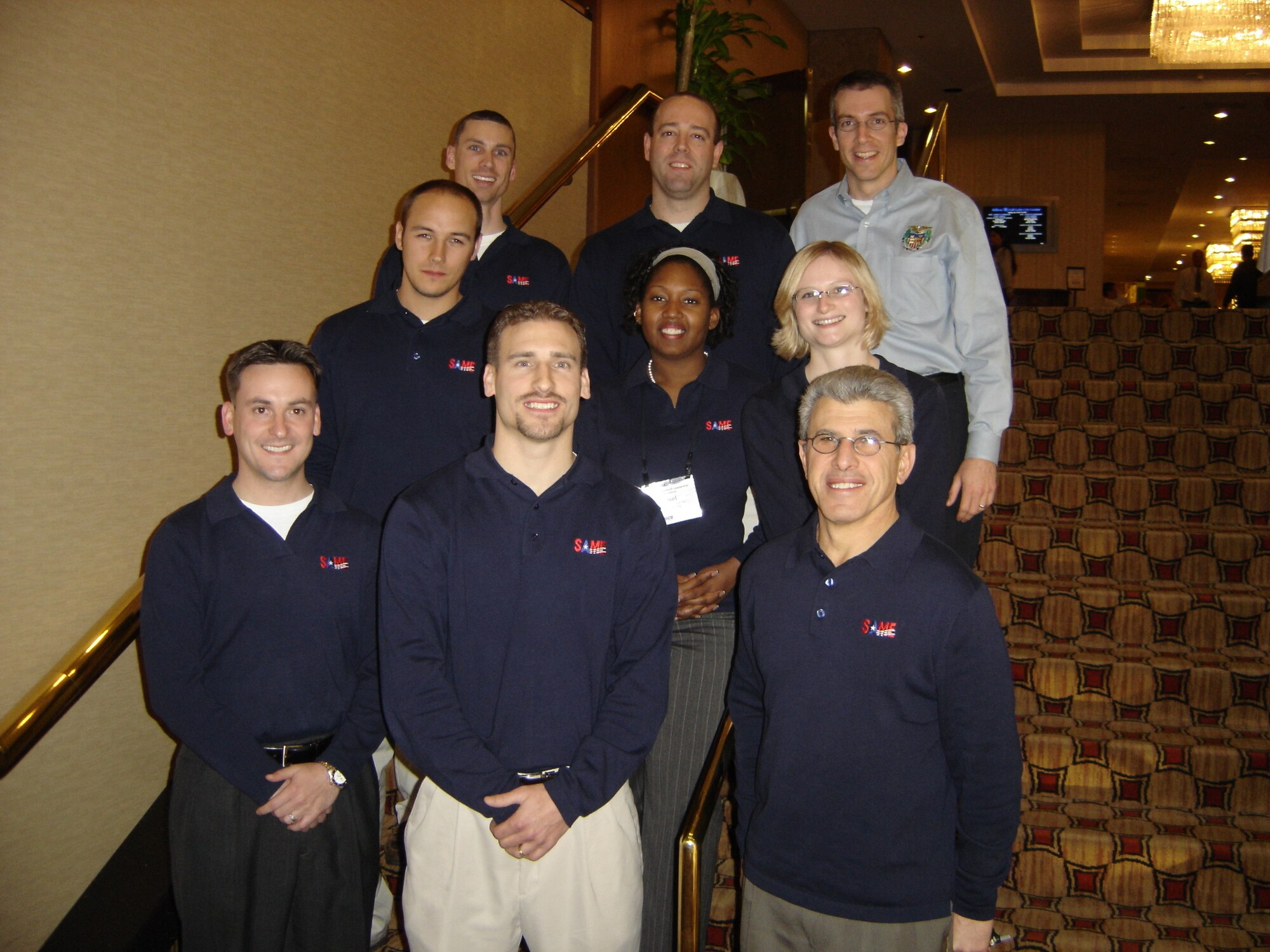 SCOTT AIR FORCE BASE, Ill. -- Maj. Patrick Miller (top center), Air Mobility Command Expeditionary Combat Support Division Strategic Plans officer, stands with fellow Society of American Military Engineers members during one of the society’s leadership workshops. Major Miller was recently awarded the SAME Young Member Medal. (Courtesy photo)