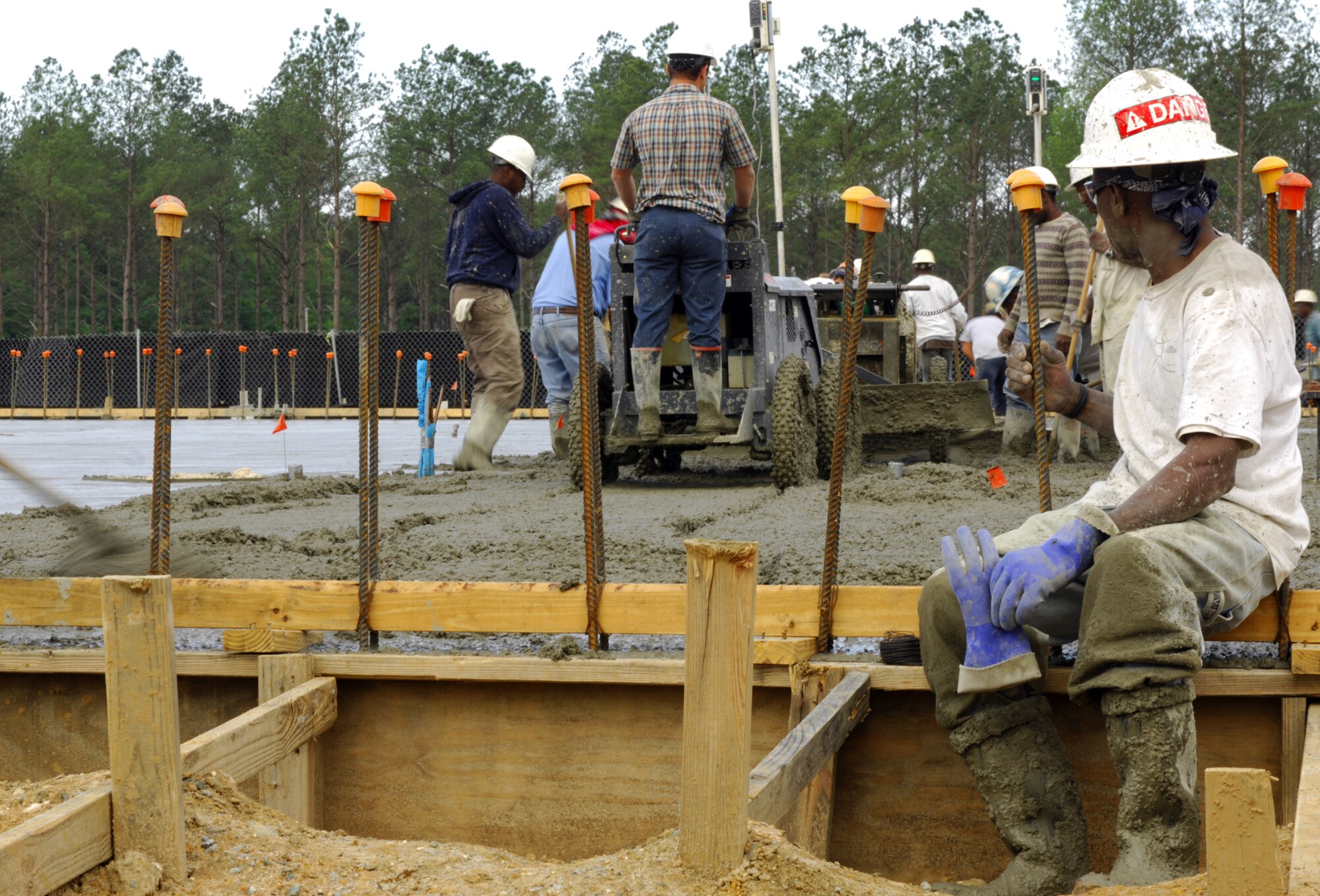 MOODY AIR FORCE BASE, Ga. -- After ninety concrete trucks and more than twelve hours of work, a concrete contractor takes a break near the end of a very long day here that started around 0100 here April 10. The contractors are working to complete a two bay fuel cell hanger that will be used for A-10 Thunderbolt II aircraft. (U.S. Air Force photo/Staff Sgt. Joshua T Jasper)