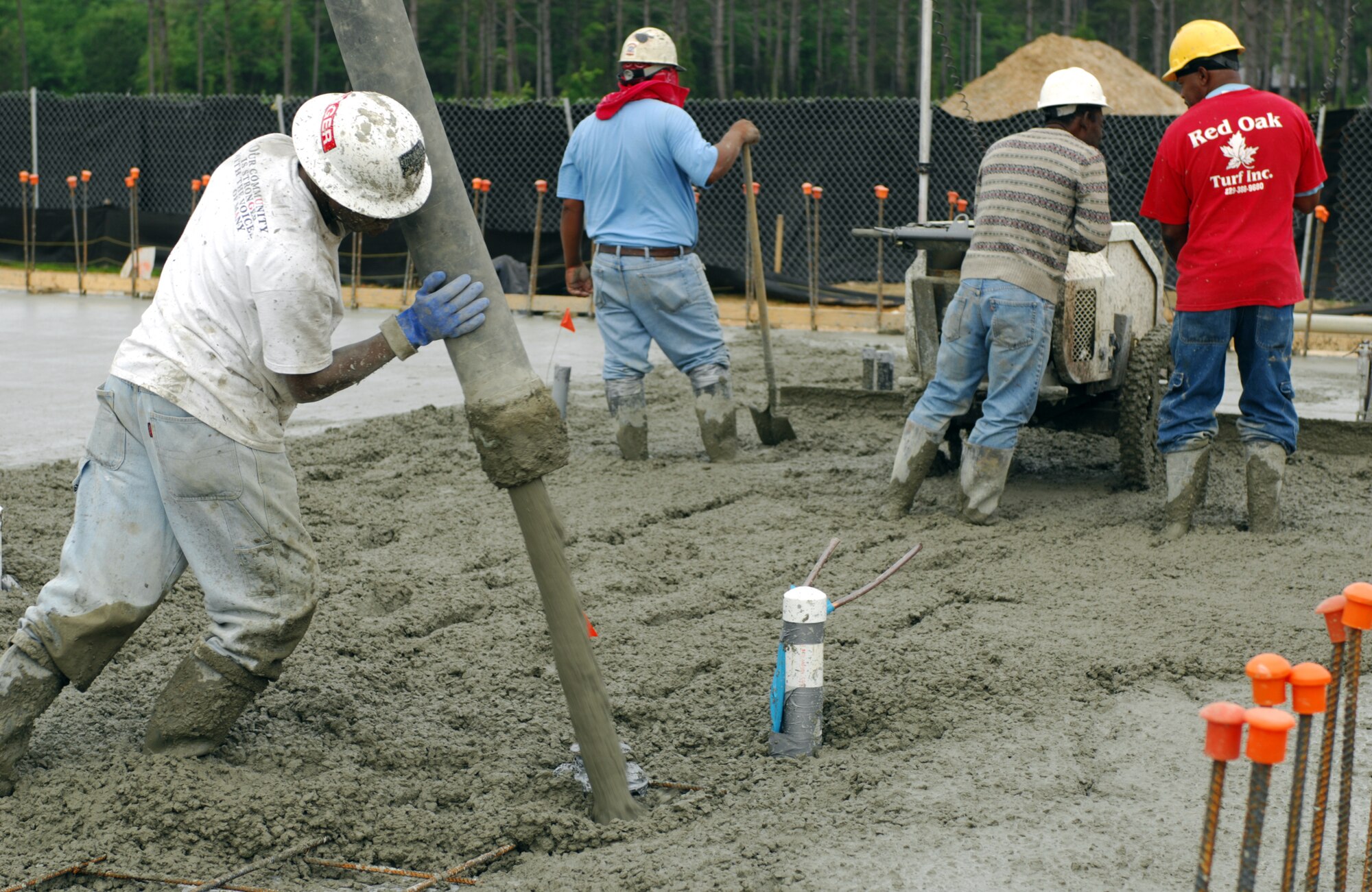 MOODY AIR FORCE BASE, Ga. -- A private contractor pours concrete here April 10. Contractors worked more than twelve hours and needed ninety concrete trucks to complete a two-bay fuel-cell hanger floor. (U.S. Air Force photo/Staff Sgt. Joshua T. Jasper)