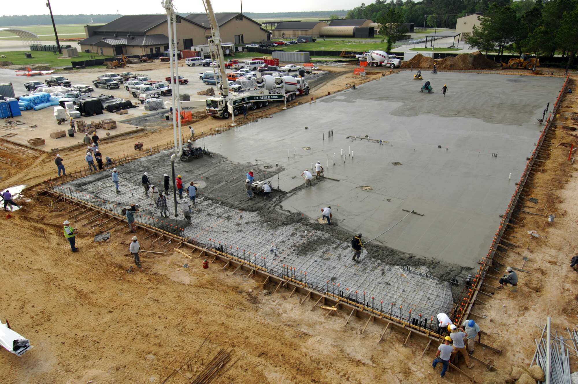 MOODY AIR FORCE BASE, Ga. -- Contractors working here April 10 to complete the floor for a two bay fuel cell hanger.  More than ninety concrete trucks and twelve hours of labor were required to pour the floor. (U.S. Air Force photo/Staff Sgt. Joshua T. Jasper)