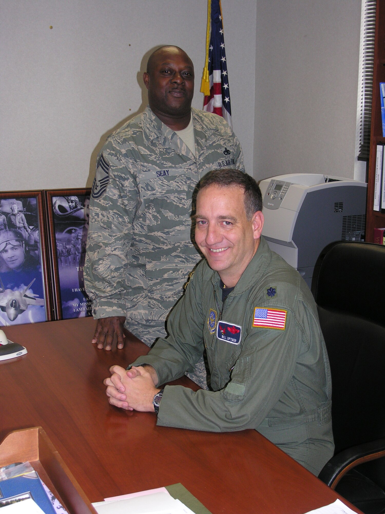 SEYMOUR JOHNSON AIR FORCE BASE, N.C. -- Lt. Col. Bill Uptmor (sitting) and Chief Master Sgt. Garry Seay are two of the key leaders for the 911th Air Refueling Squadron. Colonel Uptmor is the 911th ARS commander and Chief Seay is the superintendant in maintenance. These two active duty personnel are working alongside their Air Force Reserve counterparts as part of the new Active-associate wing which integrates the 911th as part of the 916th Air Refueling Wing. This is the first time in Air Force history that the active duty has integrated with the Reserve in this type of partnership. This announcement came as part of the 2005 Base Realignment and Closure Act and by the end of 2008 more than 250 active duty troops will support the KC-135 air-to-air refueling mission along with more than 900 reservists assigned to the 916th ARW. U.S. Air Force photo/Capt. Shannon Mann