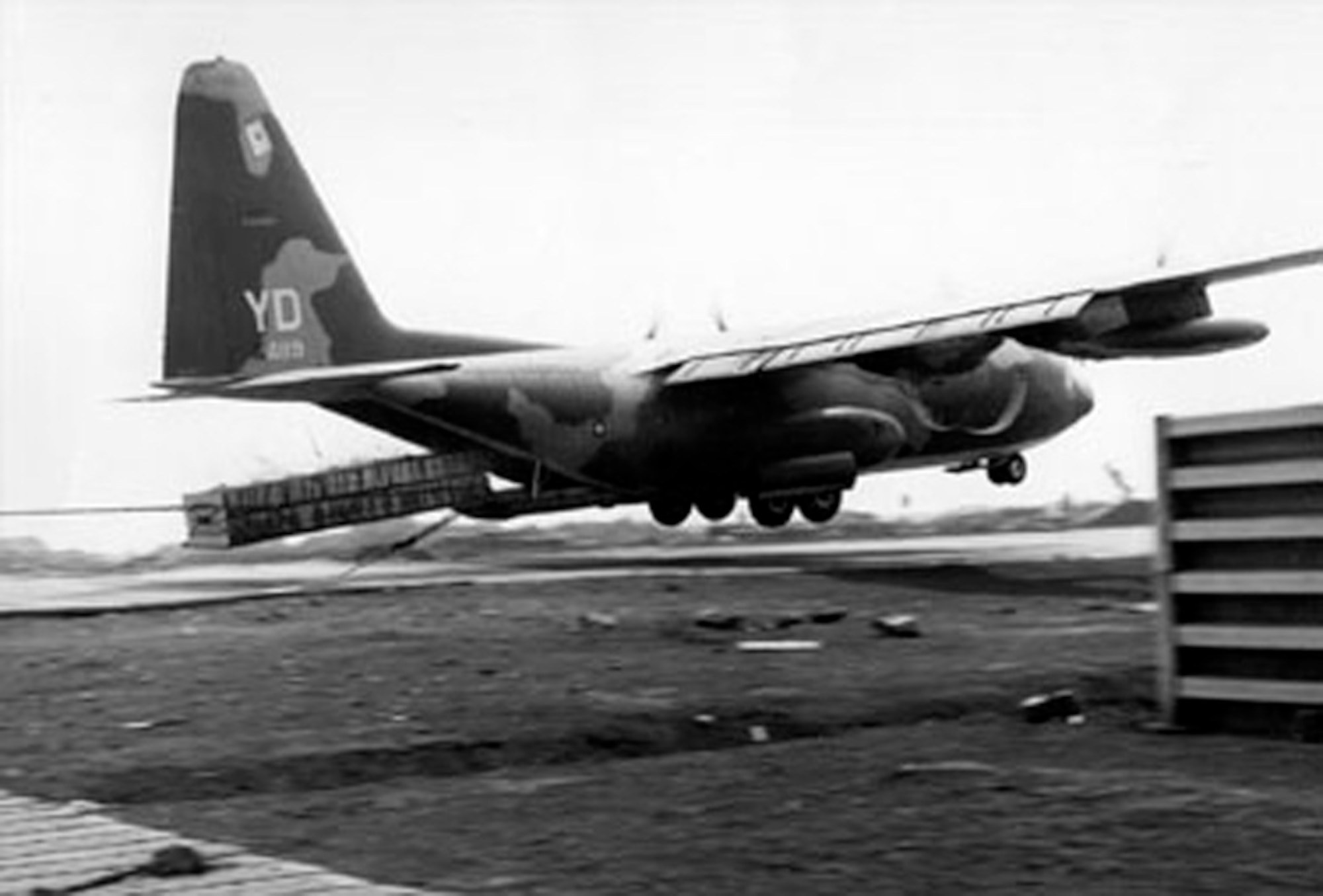 In Vietnam in 1968, the Herk resupplied the besieged Marine garrison at Khe Sanh. Exposed to enemy fire, C-130s often performed pallet insertion of desperately needed material, as seen here. (Courtesy photo)