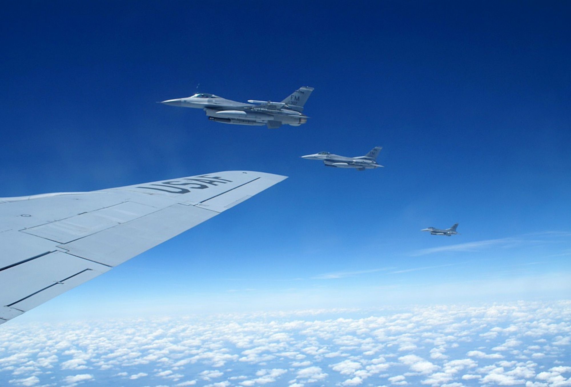 HOMESTEAD AIR RESERVE BASE, Fla. -- An Air Force Reserve F-16 pilot from the 93rd Fighter Squadron “Makos” pulls his fighter alongside a KC-135 Stratotanker during an air refueling training mission April 10, 2008. The KC-135 crew was on a temporary duty assignment to Homestead ARB from Grissom ARB, Ind., and offered to take 20 Homestead reservists along for a first-hand look at an air refueling training mission. (U.S. Air Force photo/Senior Airman Erik Hofmeyer)
