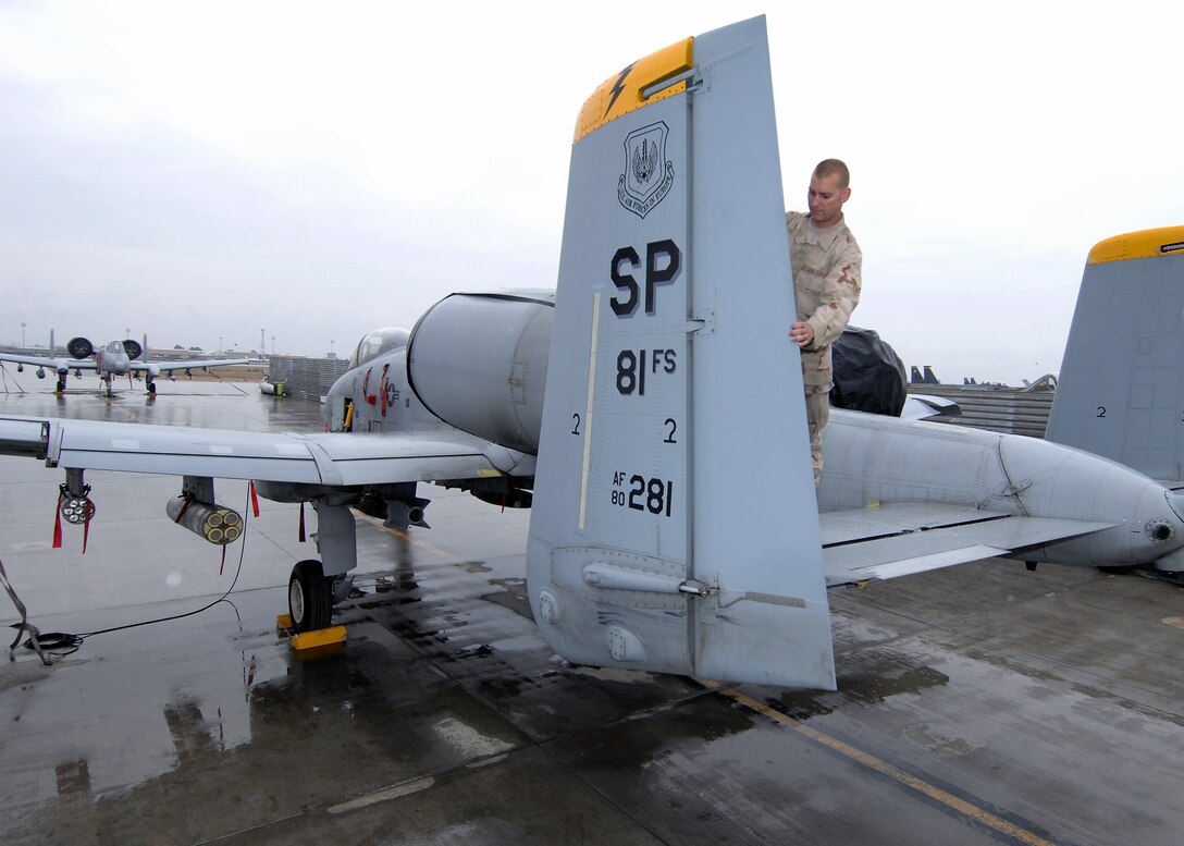 Airman 1st Class Sean Story inspects the rudder of the oldest A-10 Thunderbolt in the U.S. Air Forces in Europe command April 9 at Bagram Air Base, Afghanistan. Airman Story is deployed from Spangdahlem Air Base, Germany. (U.S. Air Force photo/Master Sgt. Demetrius Lester)