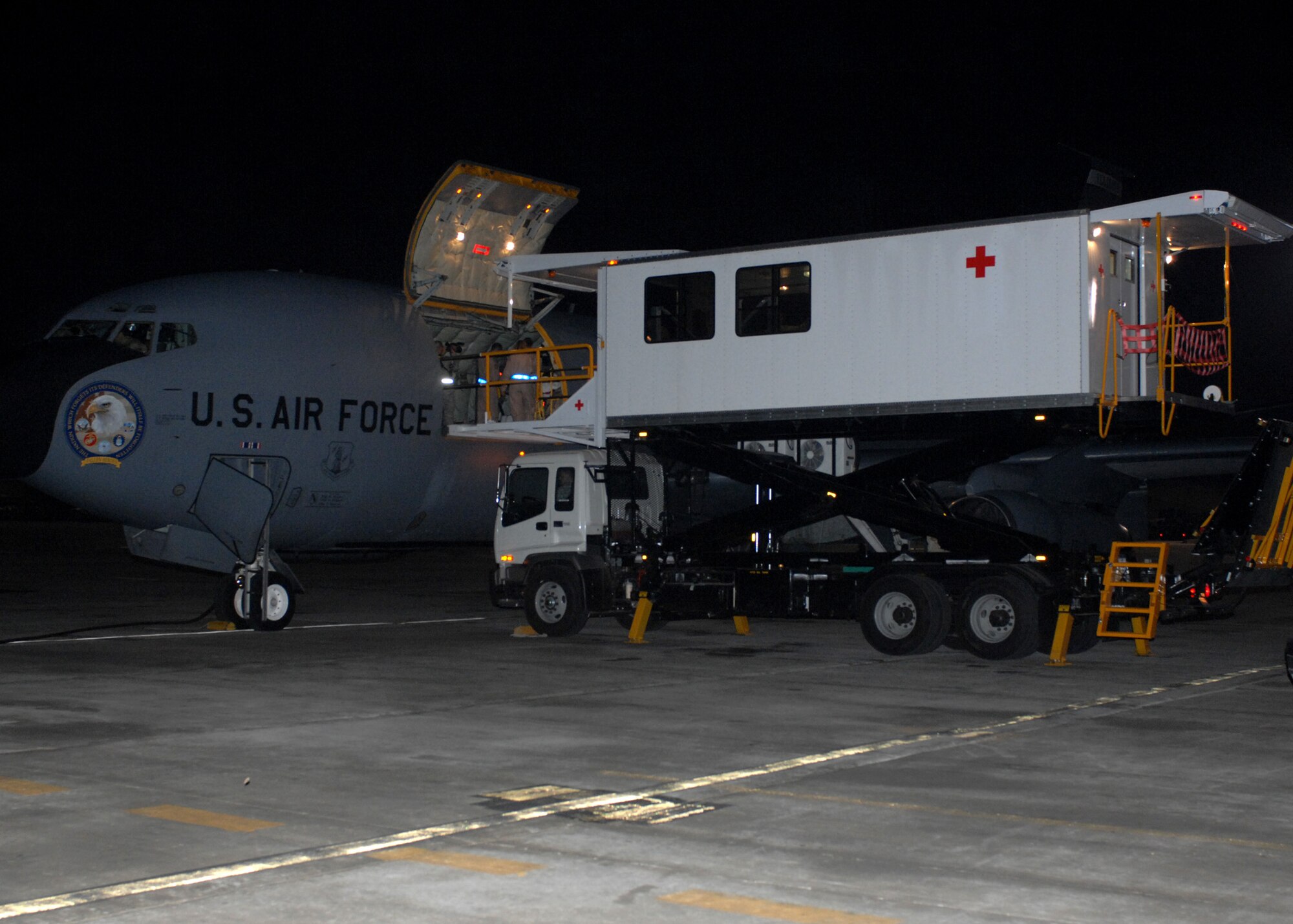 BAGRAM AIR BASE, Afghanistan - The first Air Force High Deck Patient Loading Platform aligns with a KC-135 to offload patients to be transferred to Landstuhl Army Regional Medical Center, Germany here April 9. The new HDPLP, a special purpose vehicle which limits the time a patient is exposed to outside elements, is one of three vehicles in the Air Force inventory. (U.S. Air Force photo by Master Sgt. Demetrius Lester)