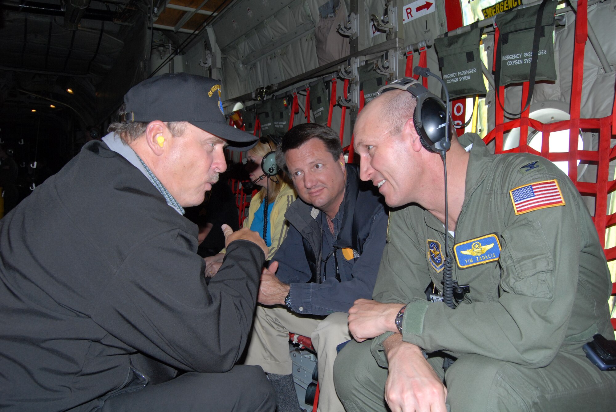 Col. Timothy Zadalis, 43rd Airlift Wing Commander, talks with Robert Grover (left), Embarq Chairman, and Judge Jim Ammons, North Carolina superior court, during the 43rd Operations Group Honorary Commanders Day flight April 4. (U.S. Air Force Photo by Staff Sgt. Jon LaDue