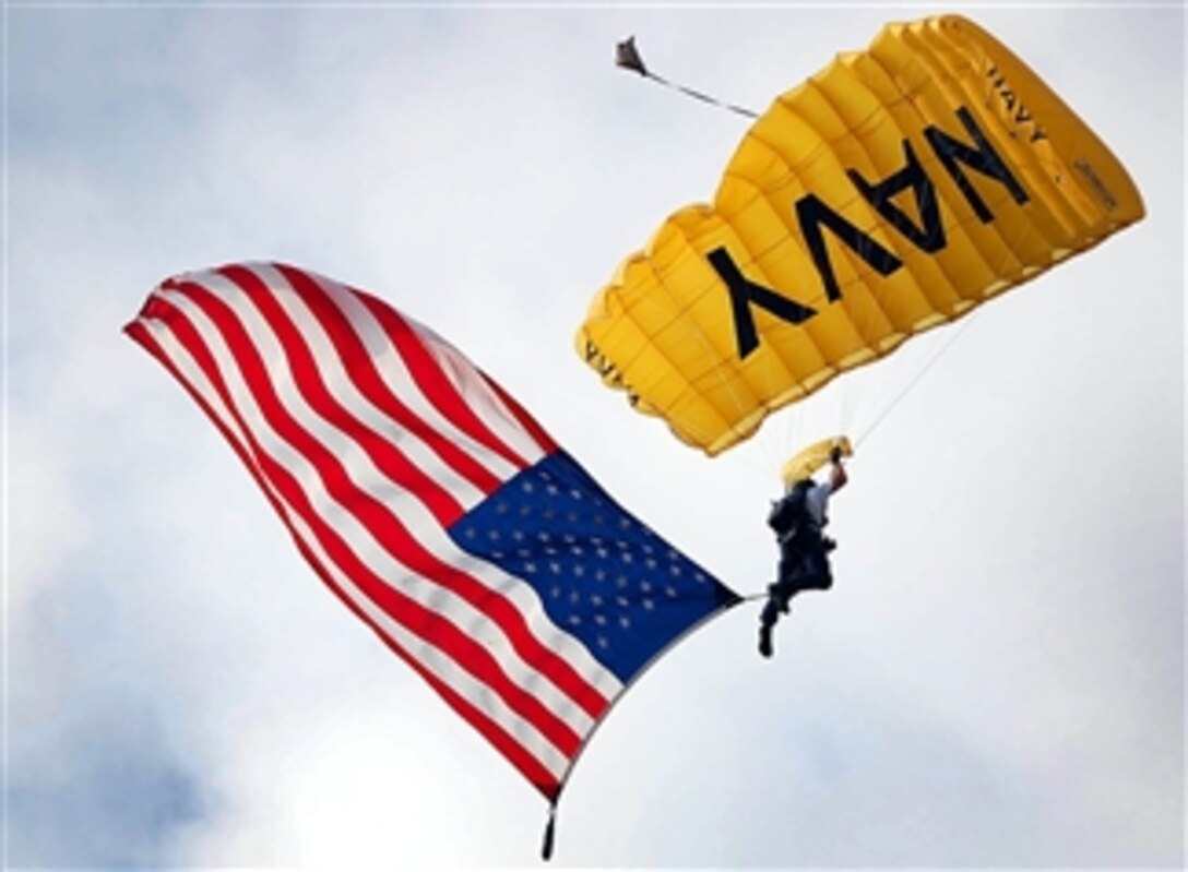 A member of the U.S. Navy Parachute Team, the "Leap Frogs," descends into Minute Maid Park during the pre-game ceremony for the opening day of the Houston Astros major league baseball season, April 7, 2008. 