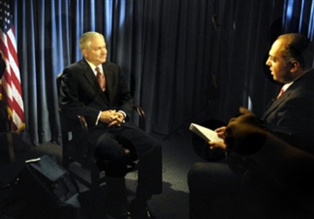 Joe Tabet of the Middle East Broadcasting Newtworks Inc., right, interviews U.S. Defense Secretary Robert M. Gates at the Pentagon, April 11, 2008. 