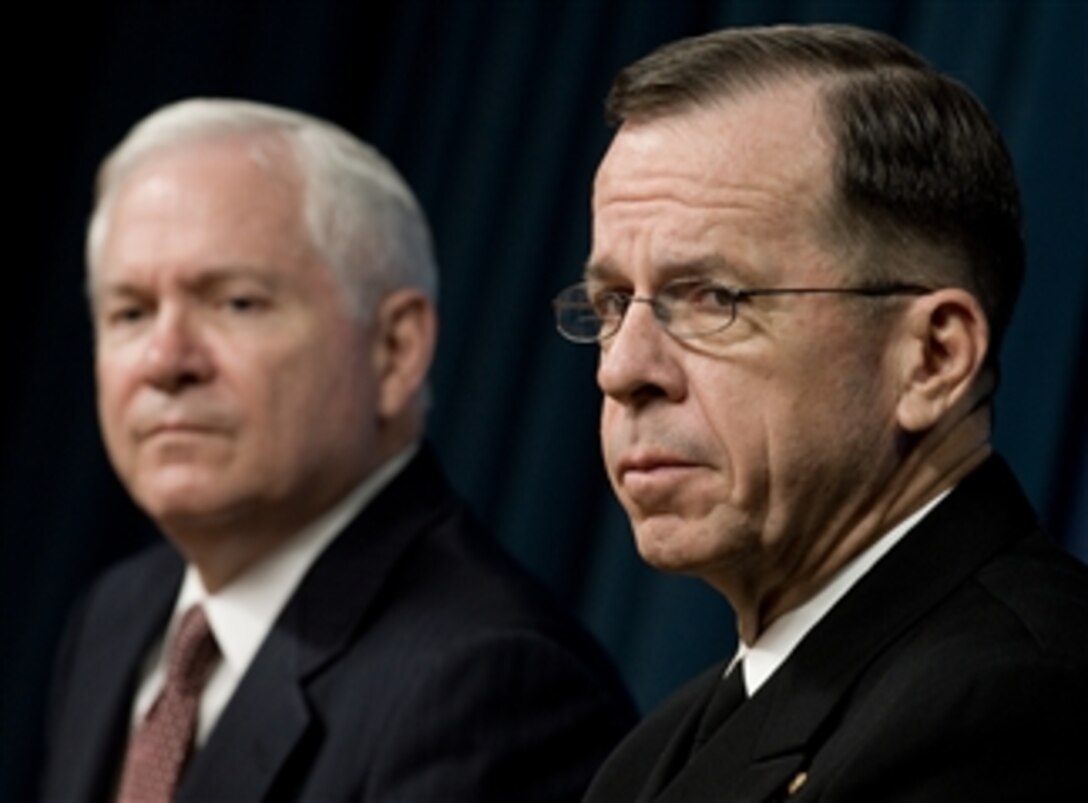 Defense Secretary Robert M. Gates, left, and U.S. Navy Adm. Mike Mullen, chairman of the Joint Chiefs of Staff, listen to questions from reporters during a briefing at the Pentagon, April 11, 2008. 