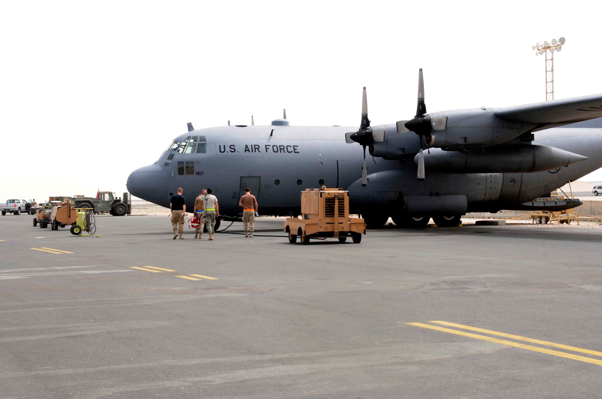 SOUTHWEST ASIA -- Members of the 746th Expeditionary Aircraft Maintenance Unit prepare to do maintenance “Patches.” The aircraft was inducted into history when Lt. Col. Howard Dallman, 345th Tactical Airlift Squadron, landed his crew and aircraft under heavy enemy fire from the People’s Army of Vietnam to re-supply besieged Marines in Khe Sanh Feb. 5, 1968. Colonel Dallman received the Air Force Cross and his crew received the Silver Star for their effort to re-supply the Marines in Khe Sanh. (U.S. Air Force photo/ Senior Airman Domonique Simmons.) 