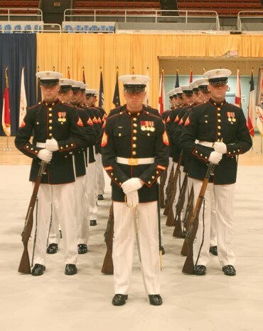 The U.S. Marine Corps Silent Drill Platoon awaits the results of the U.S. Armed Forces Joint Ceremonial Drill Competition in the National Guard Armory in Washington, D.C., April 12.  The Platoon won the event where the U.S. Army, Navy and Coast Guard all competed for the distinction of best ceremonial drill team.