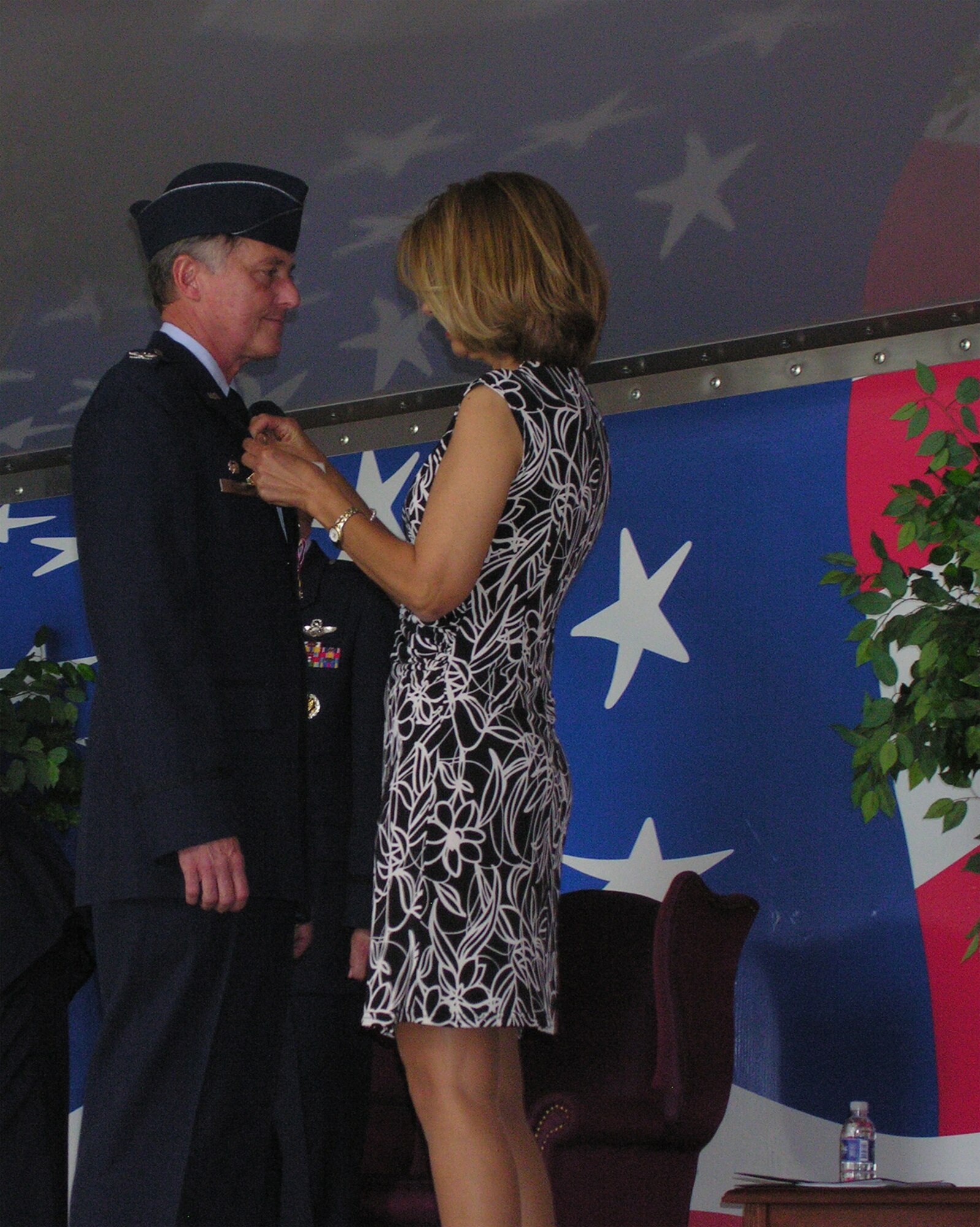 SEYMOUR JOHNSON AIR FORCE BASE, N.C. -- Col. Mark Kolleda, former commander of the 916th Operations Group, receives his retirement pin from his wife, Colleen. Colonel Kolleda retired during an official ceremony held during the April unit training assembly. He has served as the Reserve wing's operations group commander since 2003, but started his military career in 1970. U.S. Air Force photo/Ms. Donna Lea