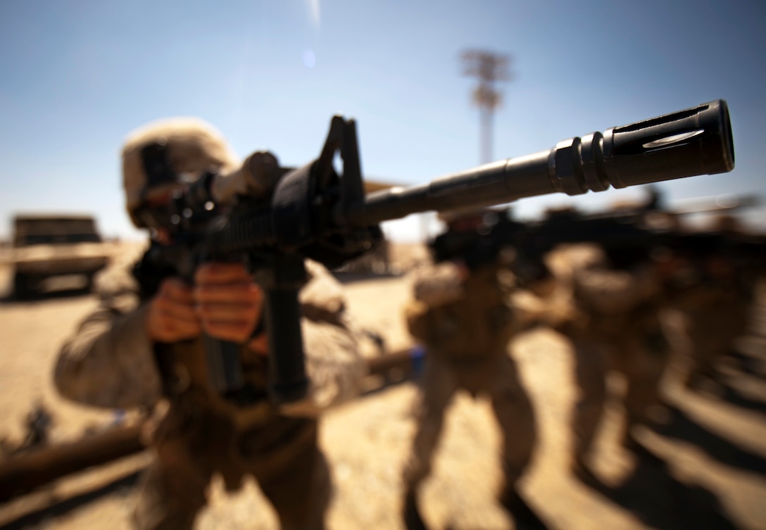MARINE CORPS AIR GROUND COMBAT CENTER TWENTYNINE PALMS, Calif. - Marines of Company E, 2nd Battalion, 25th Marine Regiment, Marine Forces Reserve, execute pivot-drills on Range 103 during Exercise Javelin Thrust 2012. Javelin Thrust 2012 is an annual large scale exercise which allows active and reserve Marines and Sailors from 38 different states to train together as a seamless Marine Air Ground Task Force. (Photo by Sgt. Alvin D. Parson/Released)