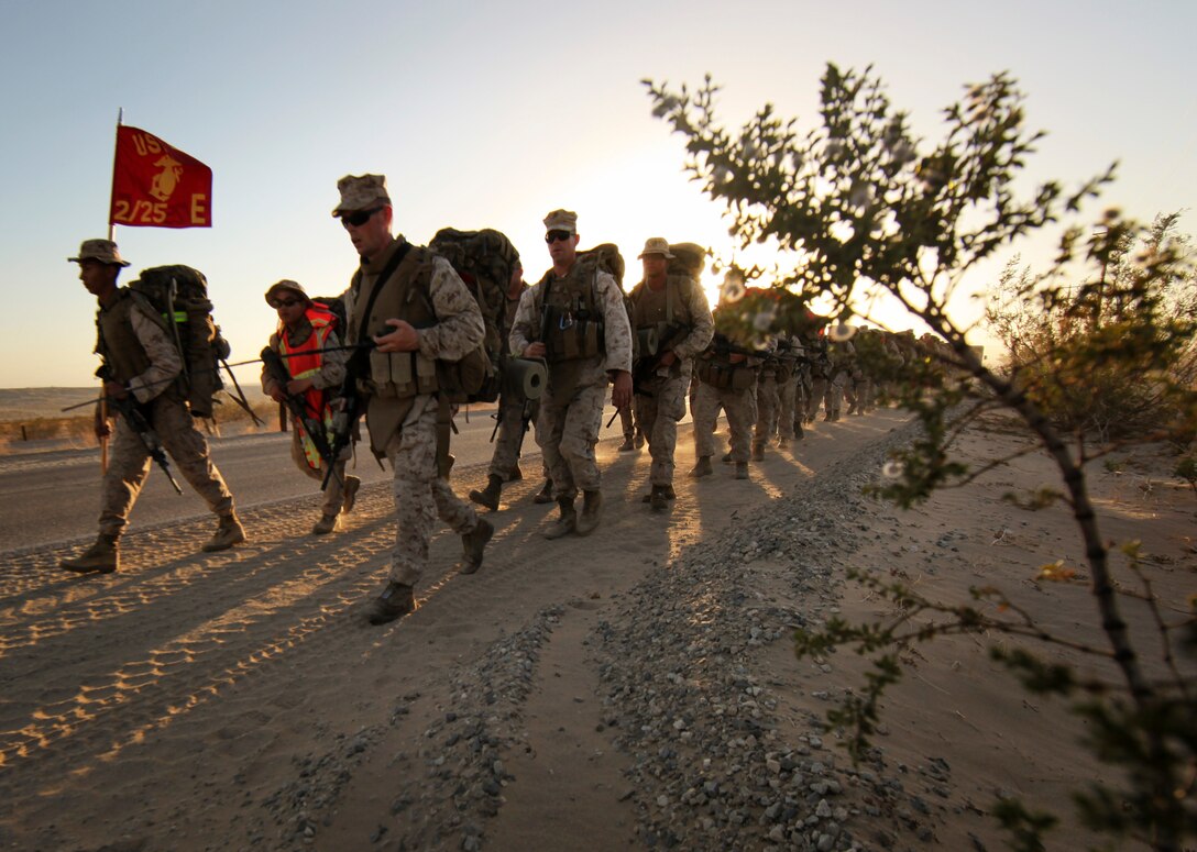 MARINE CORPS AIR GROUND COMBAT CENTER TWENTYNINE PALMS, Calif. - Marines of Company E, 2nd Battalion, 25th Marine Regiment, Marine Forces Reserve, execute a non-tactical troop movement during Exercise Javelin Thrust 2012. Javelin Thrust 2012 is an annual large scale exercise which allows active and reserve Marines and Sailors from 38 different states to train together as a seamless Marine Air Ground Task Force. (Photo by Sgt. Alvin D. Parson/Released)
