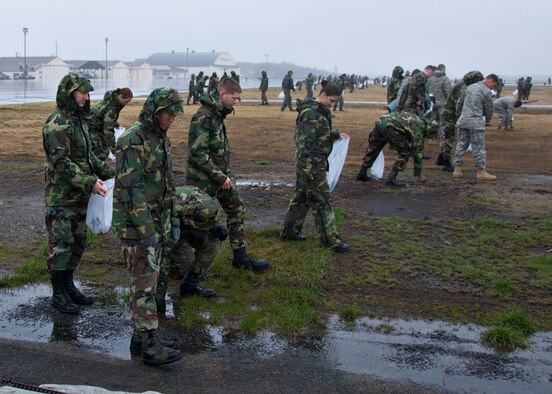 MISAWA AIR BASE, Japan -- Air Force members search the airfield for debris during the base FOD walk here April 11, 2008. Such procedures are done on a daily basis by flightline personnel, but once a year the entire base helps out. (U.S. Air Force photo by Senior Airman Chad Strohmeyer)