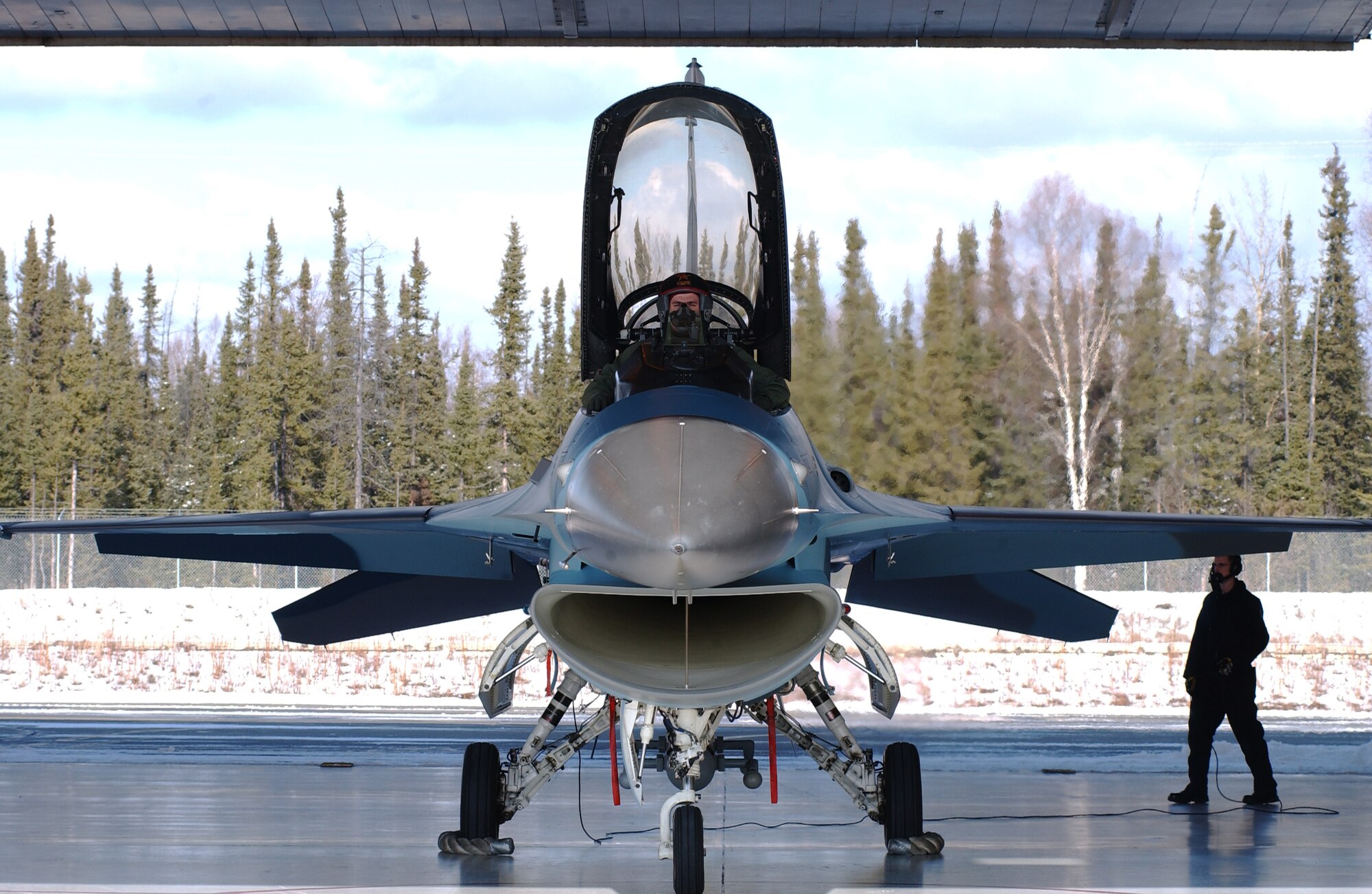 Capt. Jonathan Mumme goes through the procedure of checking the responsiveness of the flap controls on an F-16 Aggressor while Airman 1st Class Clint Gessler observes for anything unusual April 11, 2008, at Eielson Air Force Base, Alaska. During RED FLAG-Alaska 08-2 the 18th Aggressor Squadron act as the opposing force employing enemy tactics while engaging in aerial combat over the Pacific Alaskan Range Complex. Captain Mumme is a pilot assigned to the 18th AGRS. Airman Gessler is a crew chief assign to the 354th Aircraft Maintenance Squadron. (U.S. Air Force Photo/Airman 1st Class Jonathan Snyder)