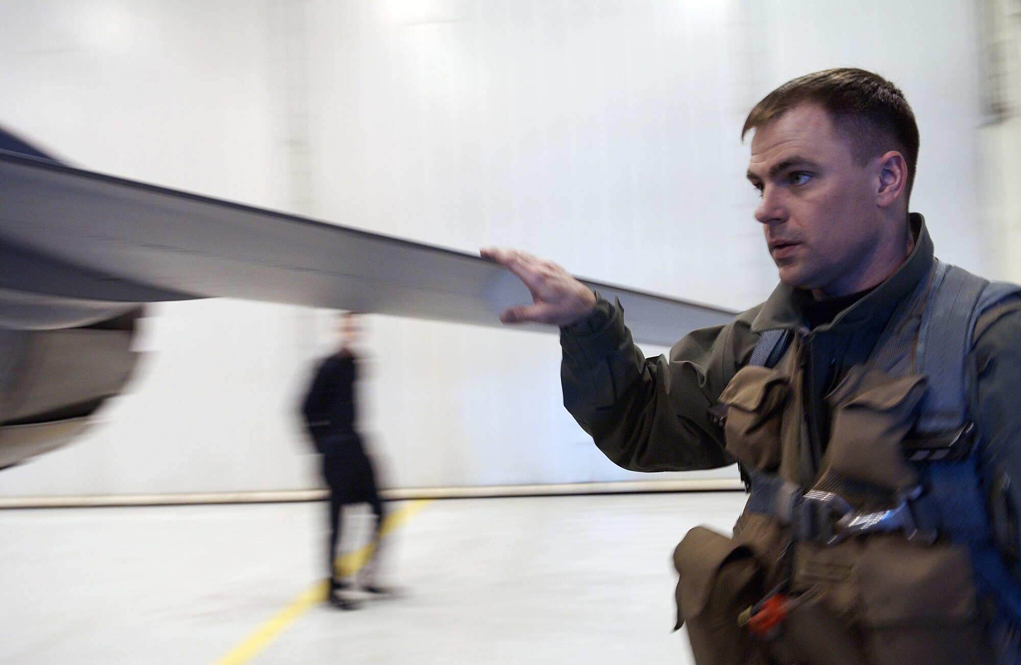 Capt. Jonathan Mumme conducts a walk-a-round pre-flight inspection of an F-16 Aggressor April 11, 2008, at Eielson Air Force Base, Alaska. During RED FLAG-Alaska 08-2 the 18th Aggressor Squadron act as the opposing force employing enemy tactics while engaging in aerial combat over the Pacific Alaskan Range Complex. Captain Mumme is a pilot with the 18th AGRS. (U.S. Air Force Photo/Airman 1st Class Jonathan Snyder)