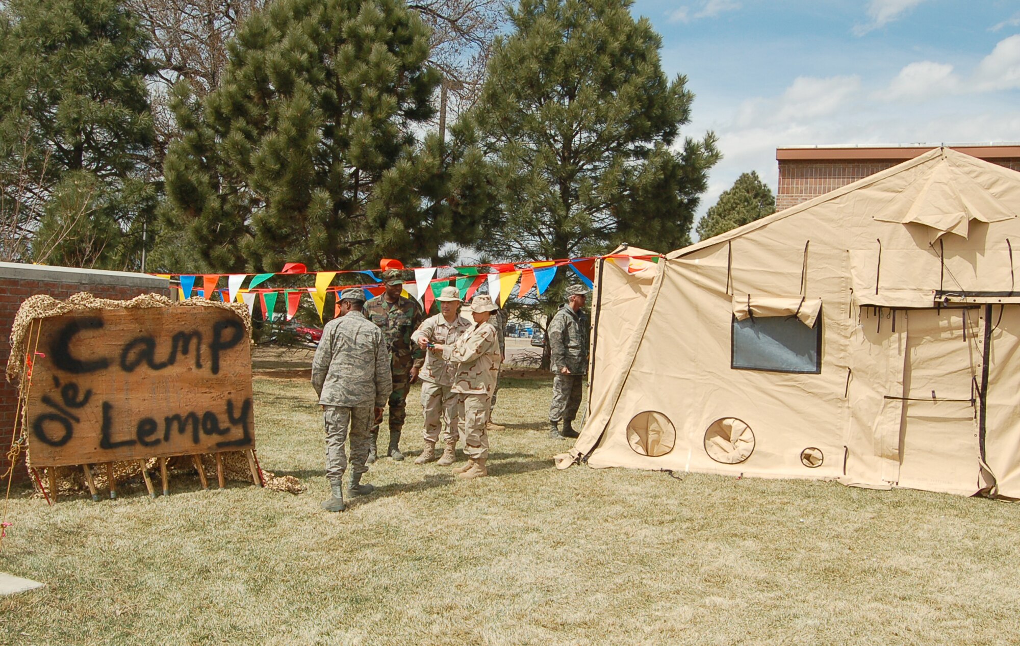 A “Camp Ole' Lemay” sign greets Gen. Curtis E. LeMay award inspectors outside an expeditionary lunch tent April 9. The 21st Services Squadron set up the tents to mimic conditions in the field and given 21st Space Wing members a small taste of deployed cooking. (U.S. Air Force photo/Corey Dahl) 