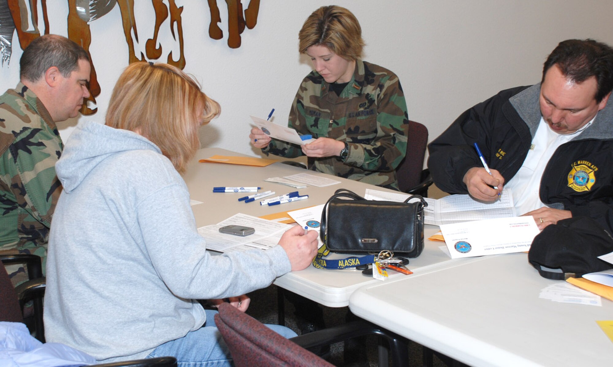 Warren members complete registration forms during the Bone Marrow Donor Registration Drive in the base medical clinic April 3.  The participants registered as potential volunteer marrow donors with the National Marrow Registry. More than 360 Airmen registered (U.S. Air Force photo/Airman 1st Class Alex Martinez).