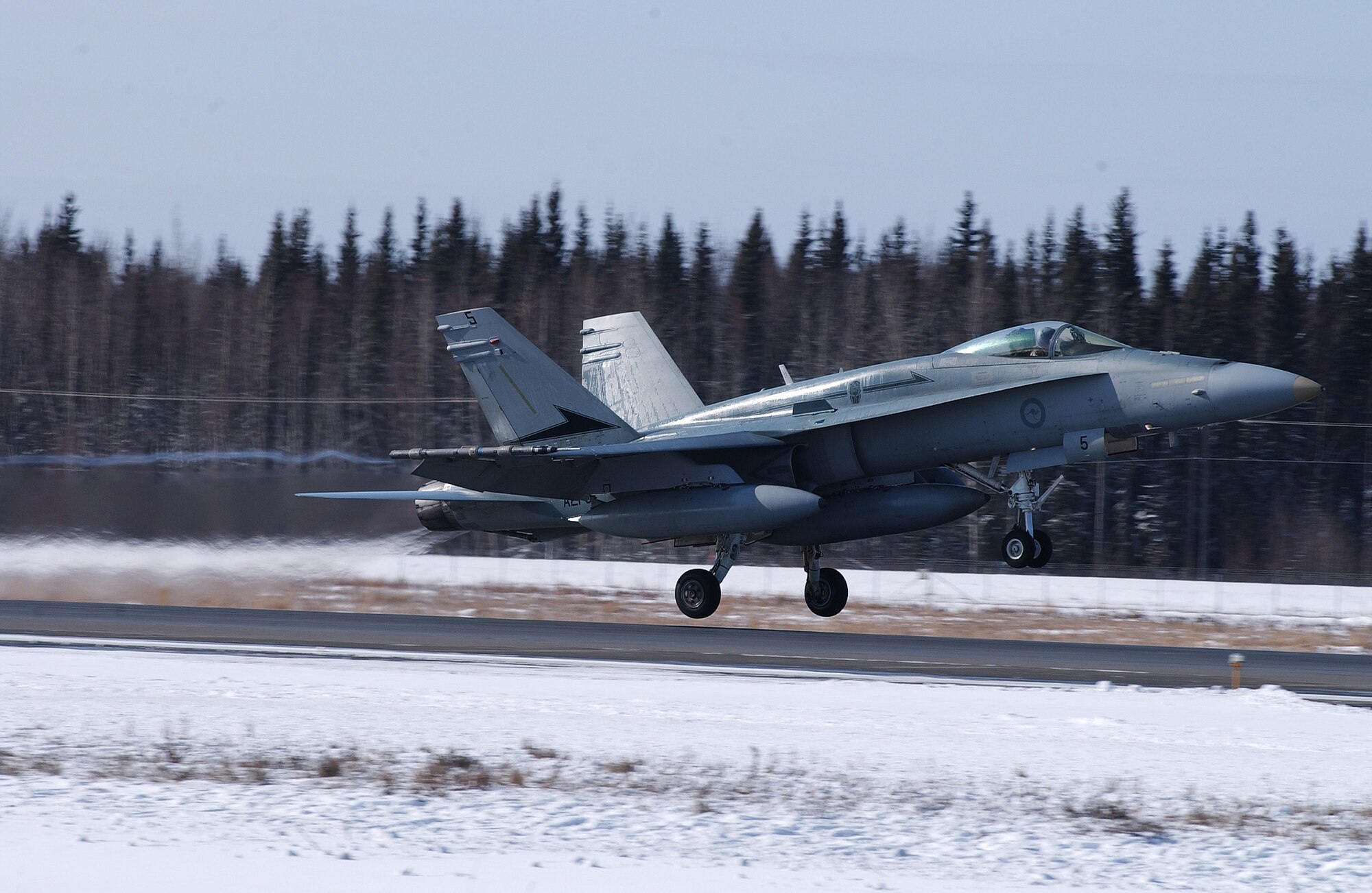 A F/A-18 Hornet takes off from the runway for a training mission at Eielson Air Force Base, Alaska April 11, 2008. RED FLAG-Alaska 08-2 is a Pacific Air Forces command directed field training exercise which provides joint offensive counter-air, interdiction, close air support and large force employment training in a simulated combat environment. The aircraft is assigned to the Royal Australian Air Force. (U.S. Air Force Photo/Airman 1st Class Jonathan Snyder)