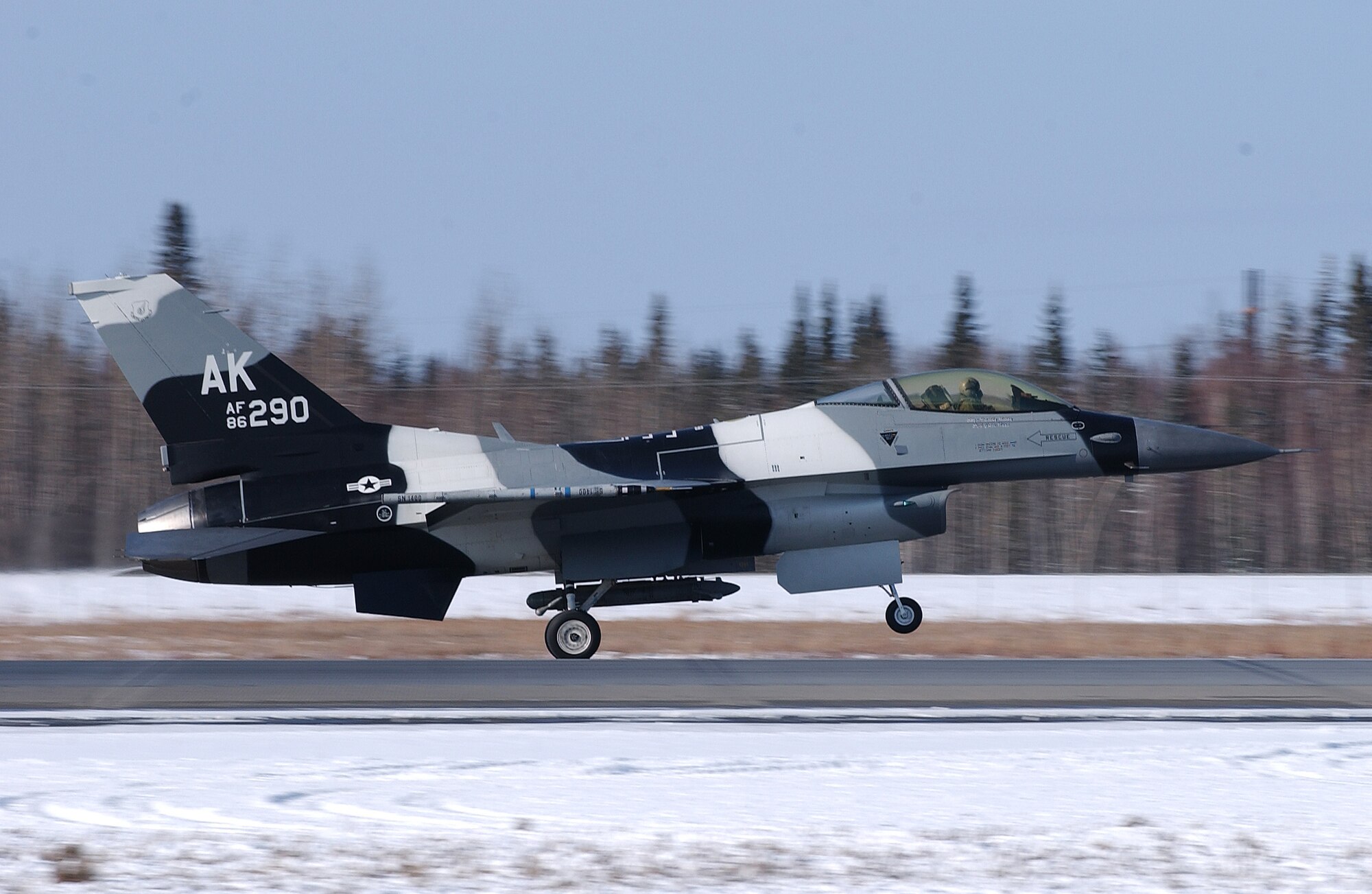 A F-16 Aggressor with the advance flanker scheme takes off for a training mission at Eielson Air Force Base, Alaska April 11, 2008. RED FLAG-Alaska 08-2 is a Pacific Air Forces command directed field training exercise which provides joint offensive counter-air, interdiction, close air support and large force employment training in a simulated combat environment. The aircraft is assigned to the 18th Aggressor Squadron. (U.S. Air Force Photo/Airman 1st Class Jonathan Snyder)