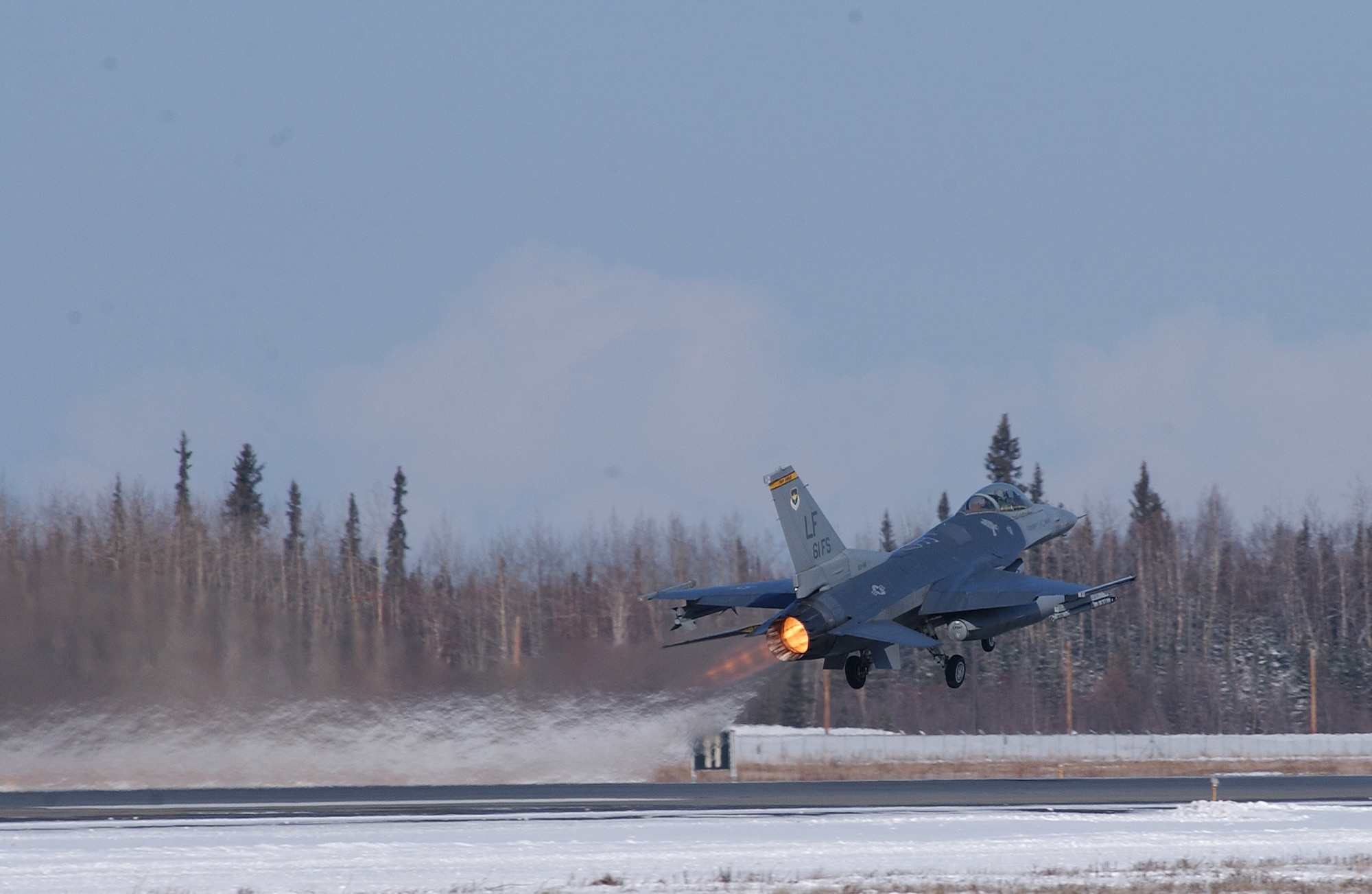A F-16 Fighting Falcon takes off from the runway with full after burner at Eielson Air Force Base, Alaska April 11, 2008. RED FLAG-Alaska 08-2 is a Pacific Air Forces command directed field training exercise which provides joint offensive counter-air, interdiction, close air support and large force employment training in a simulated combat environment. The aircraft is assigned to Luke Air Force Base, Ariz. (U.S. Air Force Photo/Airman 1st Class Jonathan Snyder)