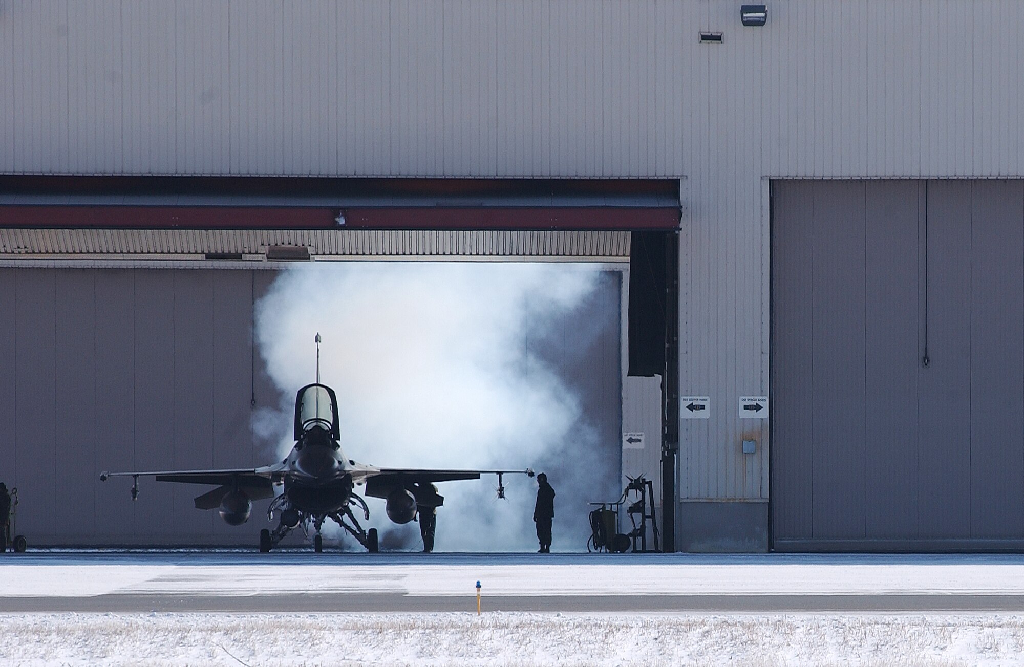 A F-16 Fighting Falcon starts its engine early in the morning at Eielson Air Force Base, Alaska April 11, 2008. RED FLAG-Alaska 08-2 is a Pacific Air Forces command directed field training exercise which provides joint offensive counter-air, interdiction, close air support and large force employment training in a simulated combat environment. The aircraft is assigned to Luke Air Force Base, Ariz. (U.S. Air Force Photo/Airman 1st Class Jonathan Snyder)
