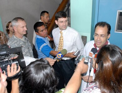 Col. (Dr.) Mike Sigmon, Joint Task Force-Bravo's medical element commander, Lt.  Col. (Dr.)  Charles Henderson,visiting urologist, and Dr. Ricardo Aviles, MEDEL medical officer respond to reporters questions during an impromptu press conference at Hospital Escuela April 11.  While working out of Hospital Escuela in Tegucigalpa March 28-April 13, the 11-person team, made up of personnel from Brooke and Madigan Army Medical Centers, operated on more than 35 patients treating problems ranging from obstructions to malignancies and problems associated with inflammatory diseases.