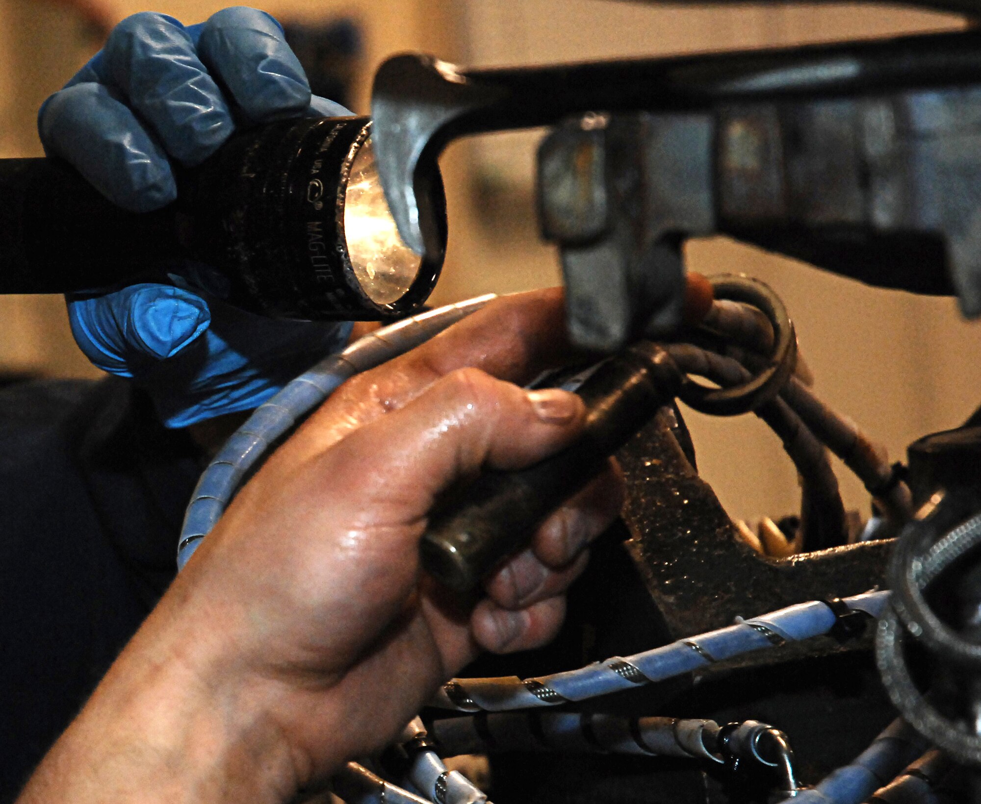 CANNON AIR FORCE BASE N.M.-- Senior Airman Daniel Datavs, 27th Special Operations Equipment Maintenance Squadron, prepares to place a tilt cylinder on a MHU Bomb lift on April 9. The Maintenance Professional of the Year banquet on April 26 will salute the bases' best maintainers.  (U.S. Air Force photo by Airman 1st Class Liliana Moreno)  
