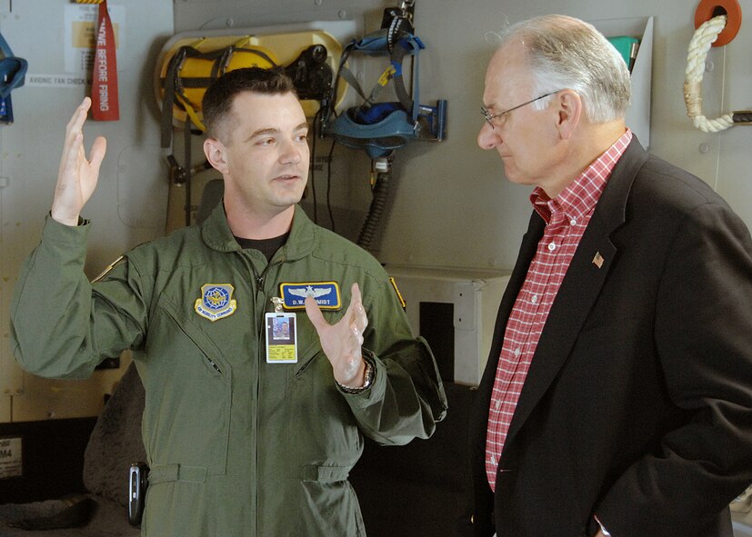 Major Donald W. Schmidt, 21 Airlift Squadron, briefs Dr. James I. Finley, Deputy Under Secretary of Defense for Acquisition and Technology, on the operation and mission of the C-17 Globemaster III cargo aircraft, one of the three weapons systems flown by the 60 Air Mobility Wing at Travis AFB CA, during a tour of the aircraft.U.S. Air Force Photo by David W. Cushman, DAFC