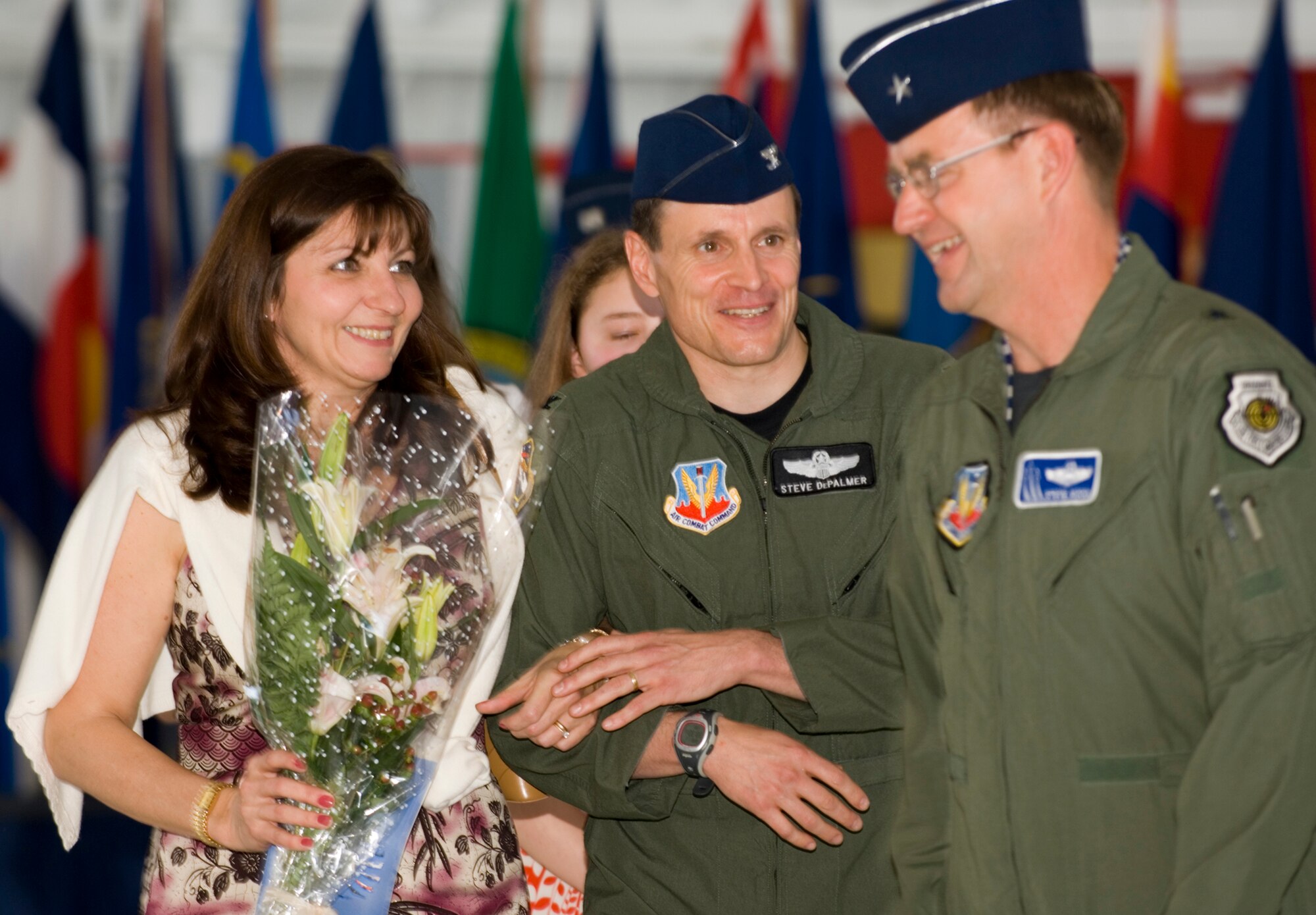 Col. Steve DePalmer, 53d Wing commander, talks with wife Sheila and Brig. Gen. Stephen Hoog, United States Air Force Warfare Center commander, after the wing change of command ceremony April 11 at Eglin Air Force Base, Fla.  Colonel DePalmer assumed command of the wing from Col. Ken Wilsbach.  Air Force photo by Debbie Haussermann.