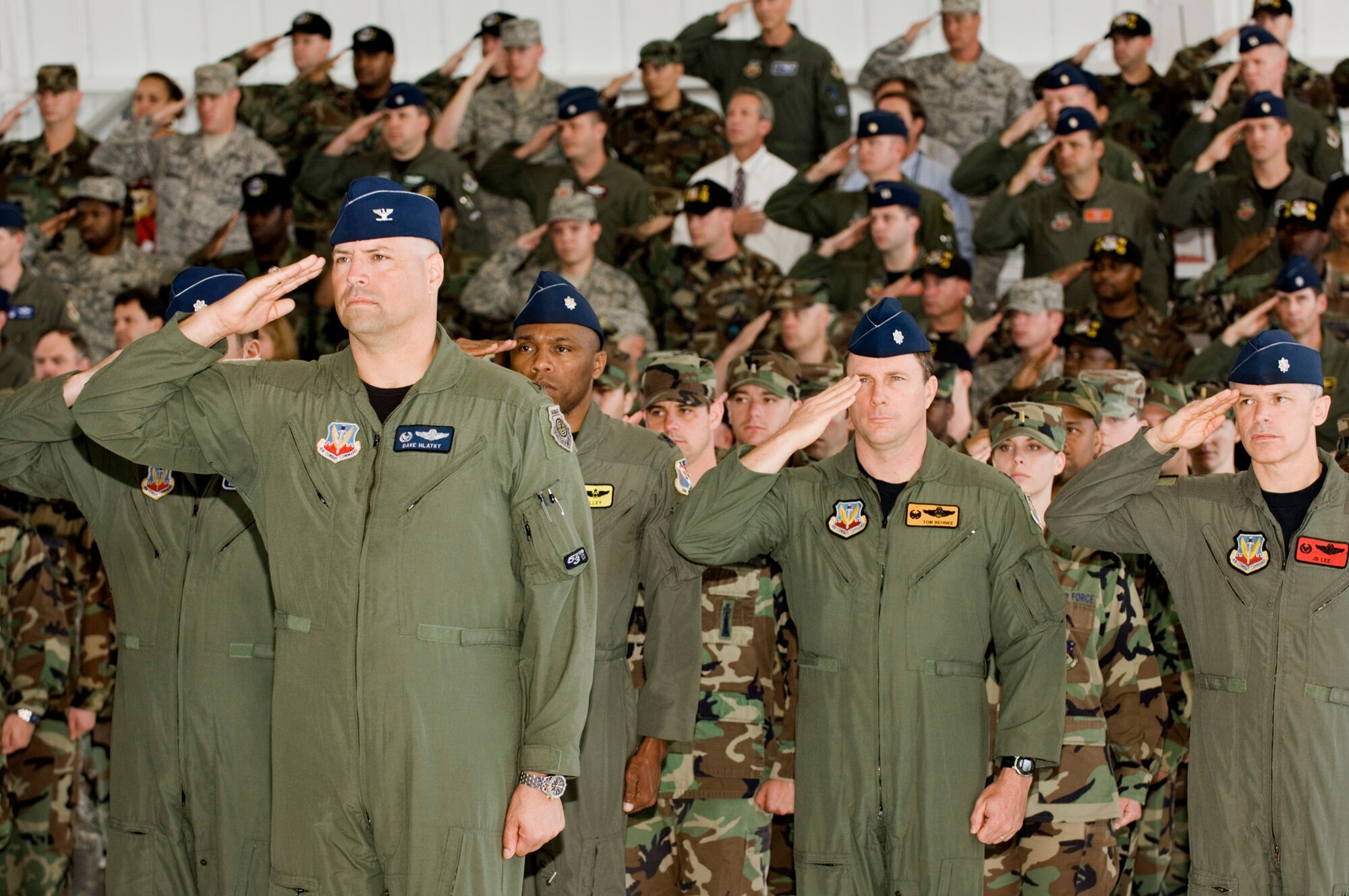 Col. Dave Hlatky, 53d Weapons Evaluation Group salutes standing in front of his flight and other 53d Wing members during the national anthem at the change of command ceremony April 11 at Eglin Air Force Base, Fla.  Col. Steve DePalmer assumed command of the wing from Col. Ken Wilsbach.  Brig. Gen. Stephen Hoog, United States Air Force Warfare Center commander, presided over the ceremony.  Air Force photo by Debbie Haussermann.