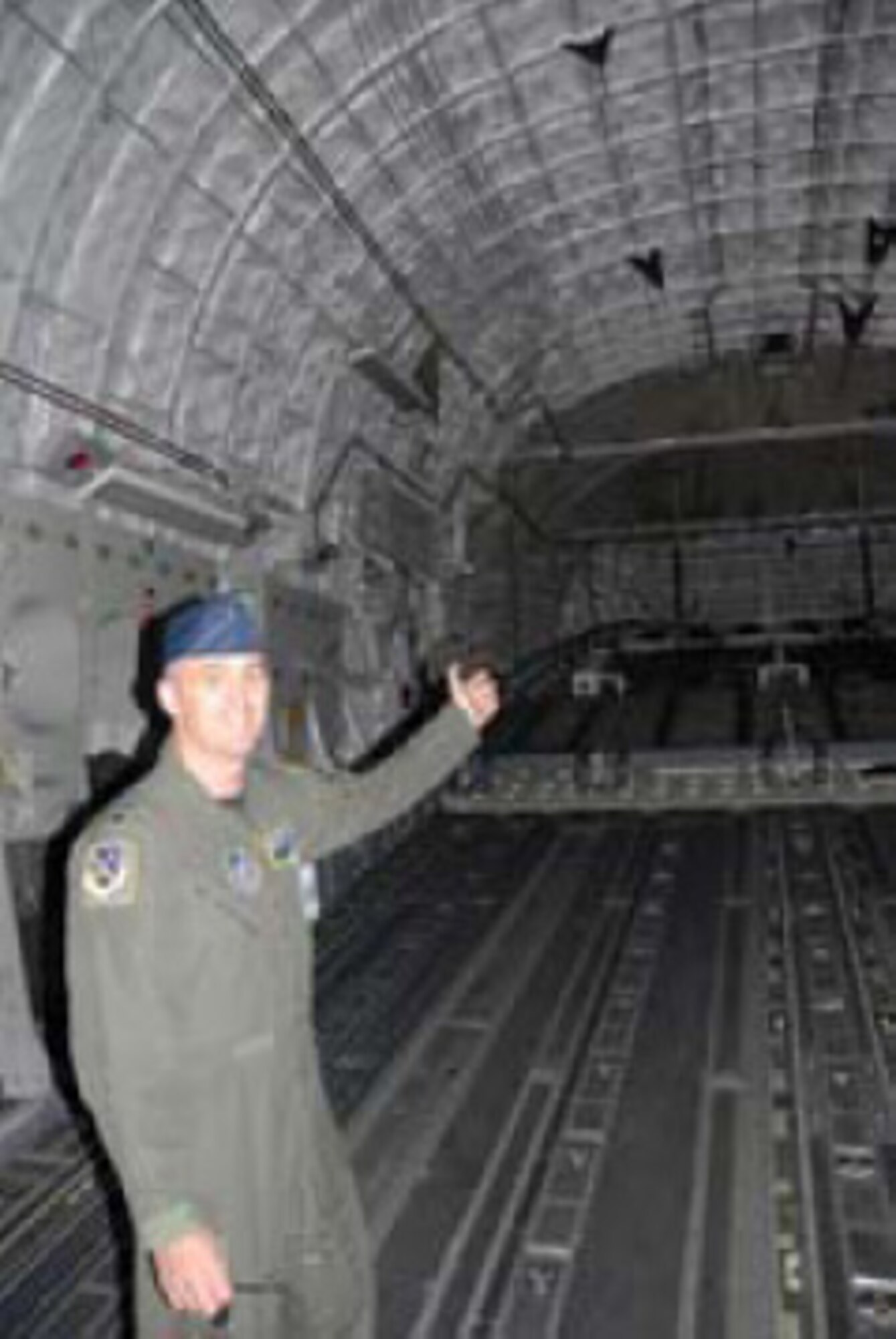 Lt. Col. Carl Lincoln shows off the Globemaster’s roomy cargo area, one of many military-specific design features.