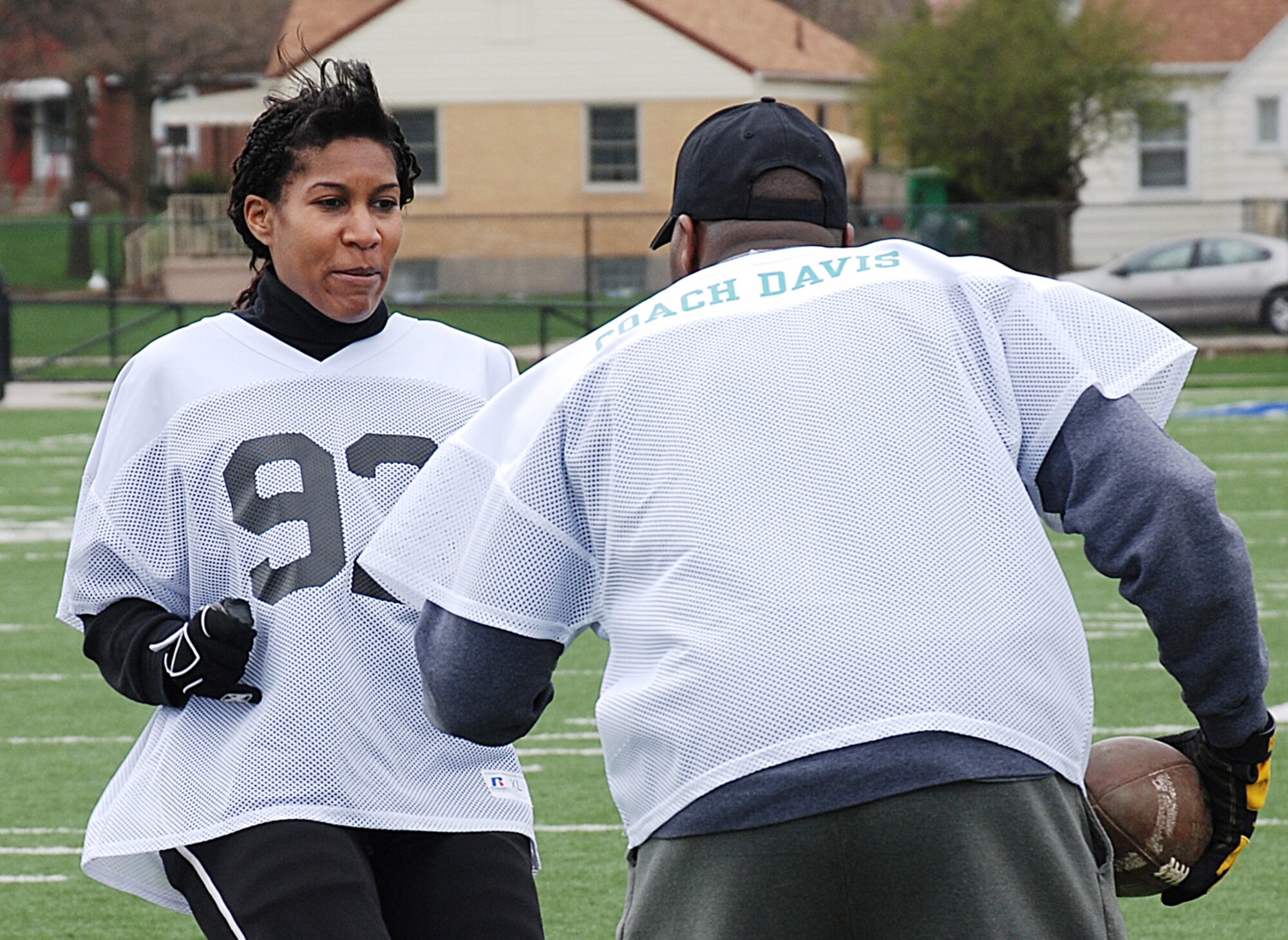 Wide receiver Robyn Bradford, a student researcher at the 711th Human Performance Wing's Human Effectiveness Directorate, works out against Dayton Diamonds defensive coordinator Jonathan Davis III at Roush Stadium in Kettering on April 11. (Photo by Chris Gulliford AFRL/RH)